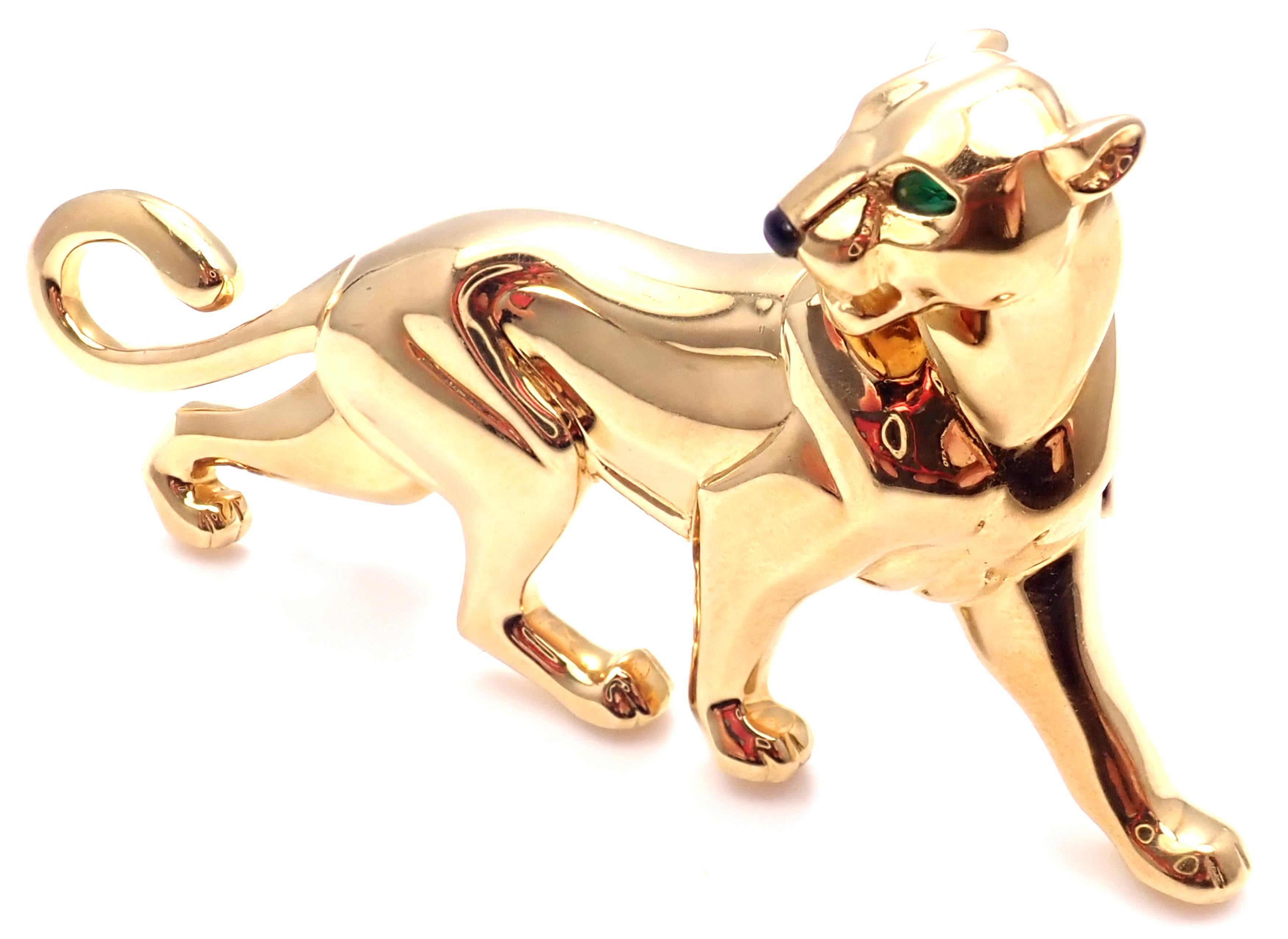 18k Yellow Gold Emerald Large Panther Pin Brooch by Cartier. 
This brooch comes with an original Cartier box. 
With Black Onyx nose, Emerald eyes.
 Details: 
 Measurements: 76mm x 36mm
 Weight: 35.9 grams
 Stamped Hallmarks: Cartier 750 724918