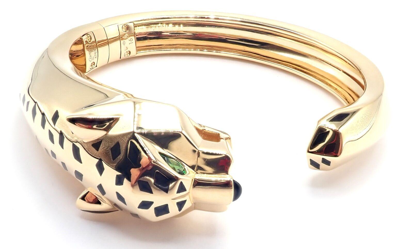 18k Yellow Gold Panther Panthere Tavorite Onyx  Size 16 Panther Bangle Bracelet by Cartier.
The Cartier Panther Panthere bangle is a luxurious piece, crafted in 18k yellow gold. 
This size 16 bracelet features the iconic panther motif, a symbol of
