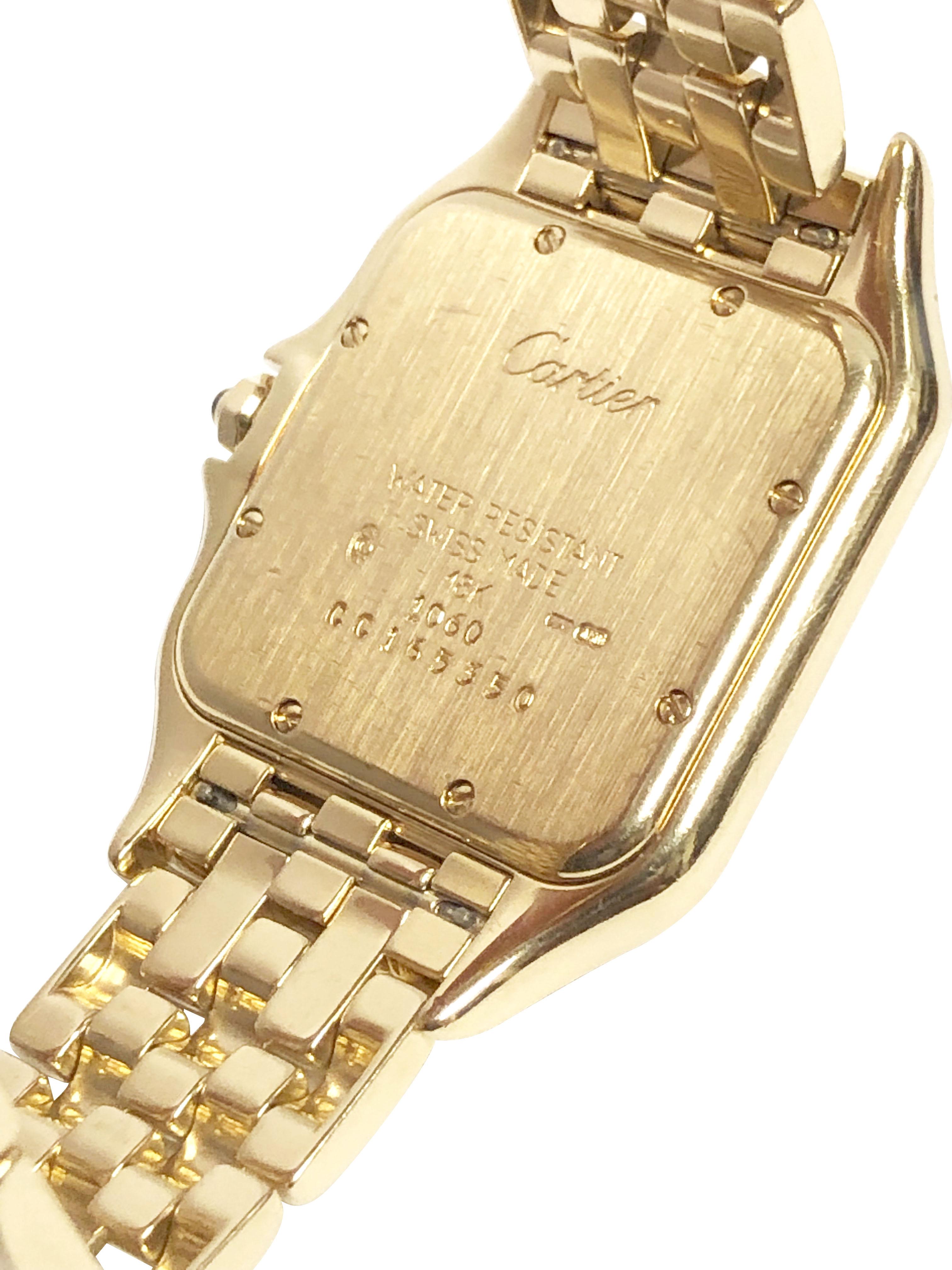 Circa 2000 Cartier Panther collection Reference 1060 Wrist Watch, 38 M.M. ( Lug end to end ) x 27 M.M. 18K Yellow Gold 3 piece water resistant case. Quartz Movement, Sapphire Crown, Silver White Dial with Black Roman numerals, sweep seconds hand and