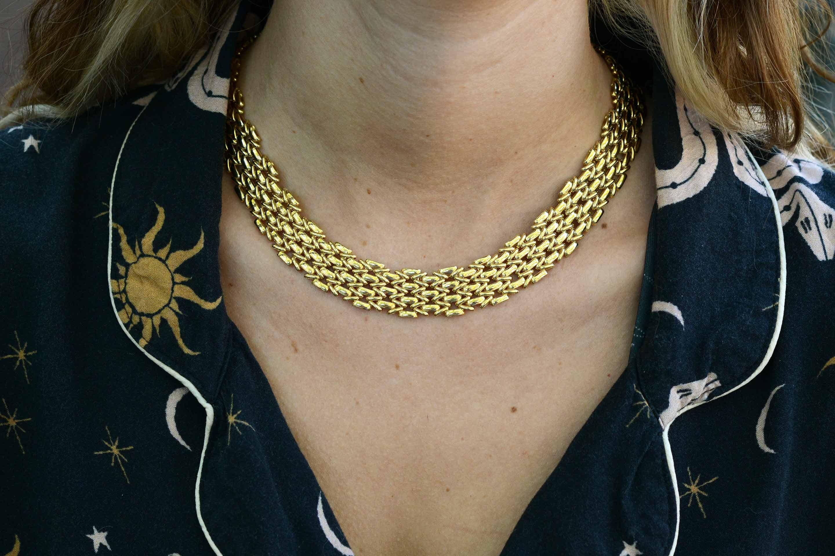 This lustrous, wide choker necklace is a true icon. A circa 1980's Italian contemporary heirloom spurring to be worn. Styled after the favored Cartier Panther necklace, over 3 ounces of buttery 18kt gold shining from every angle. A fashionable