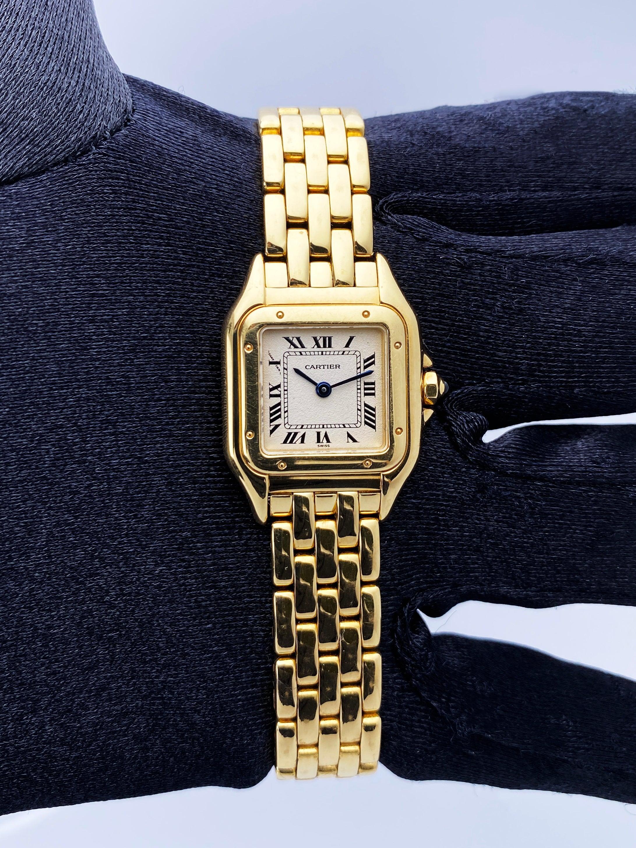 Cartier Panthere 1070 Ladies Watch. 22mm 18K yellow gold case. 18K yellow gold smooth bezel. Off-white dial with blue steel hands and Roman numeral hour markers. Minute markers on the inner dial. 18K yellow gold bracelet with hidden butterfly clasp.
