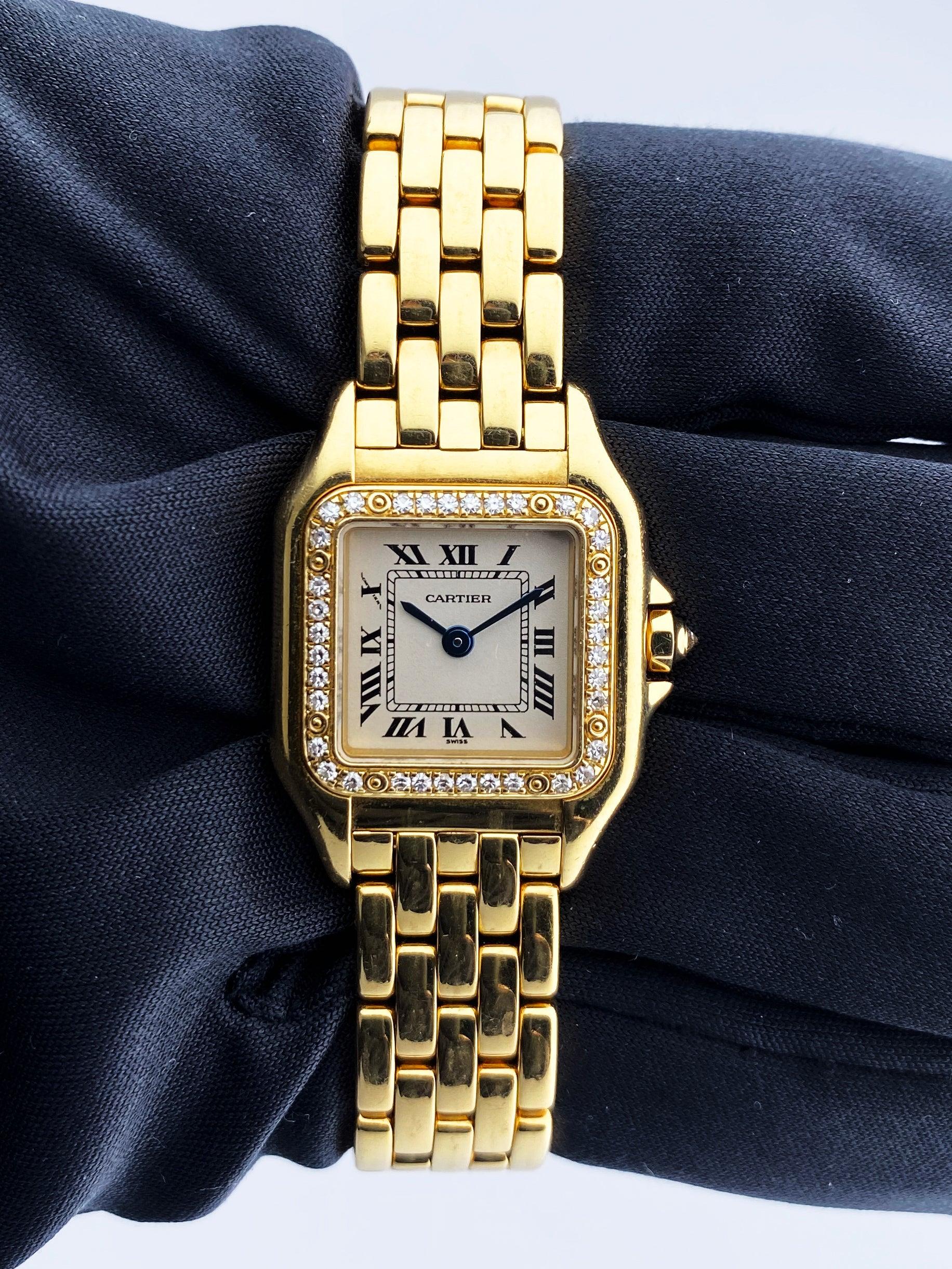 
Cartier Panthere 1280 Ladies Watch. 22mm 18K yellow gold case with original factory diamond set bezel. Off-white dial with blue hands and black Roman numeral hour marker. Minute markers on the inner dial. 18K yellow gold bracelet with hidden