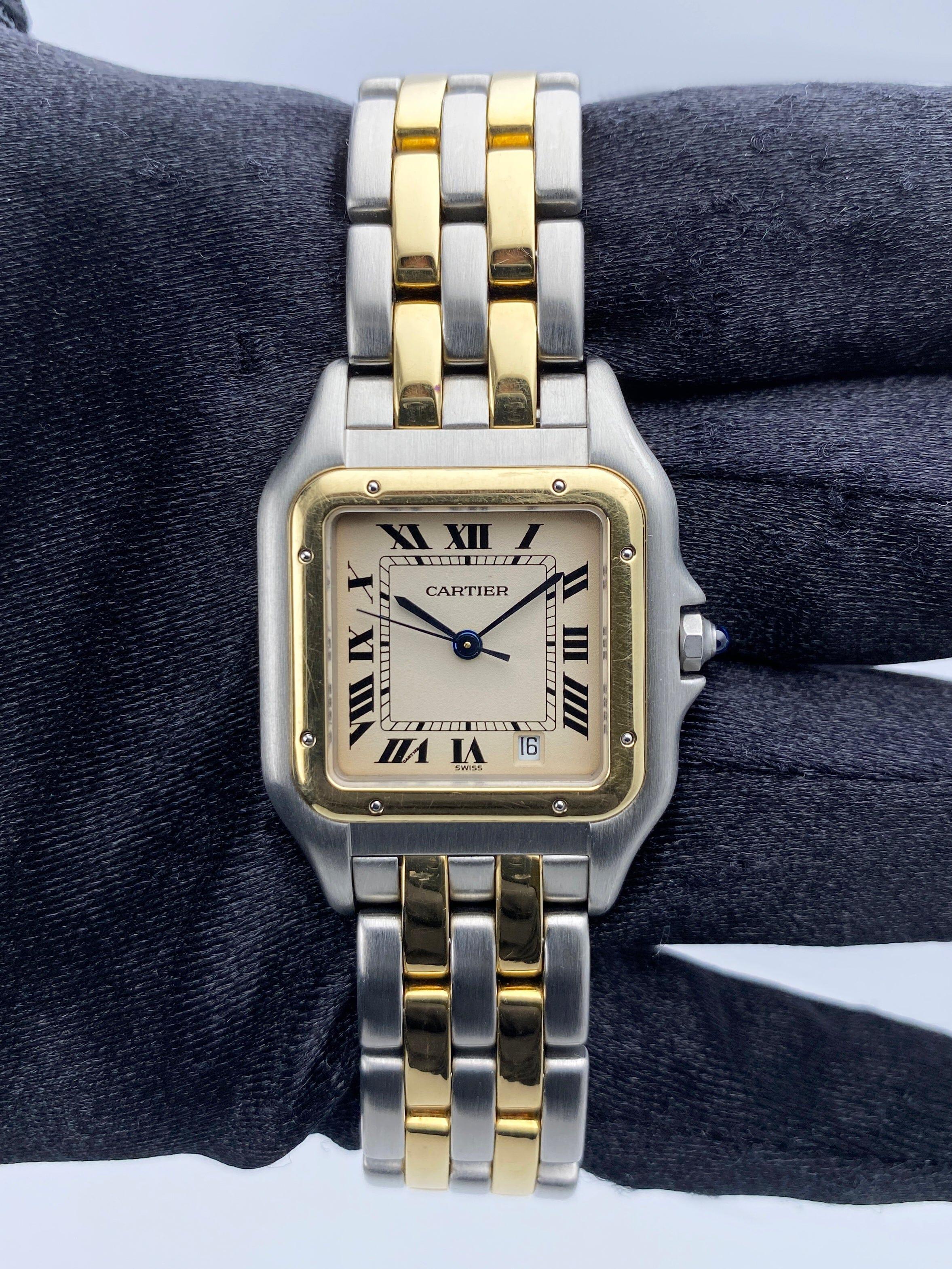 Cartier Panthere Midsize 183949 Ladies Watch. 27mm stainless steel case. 18K yellow gold fixed bezel. Off-White dial with blue steel hands and Roman numeral hour markers. Minute markers on the inner dial. Date display at the 5 o'clock position.