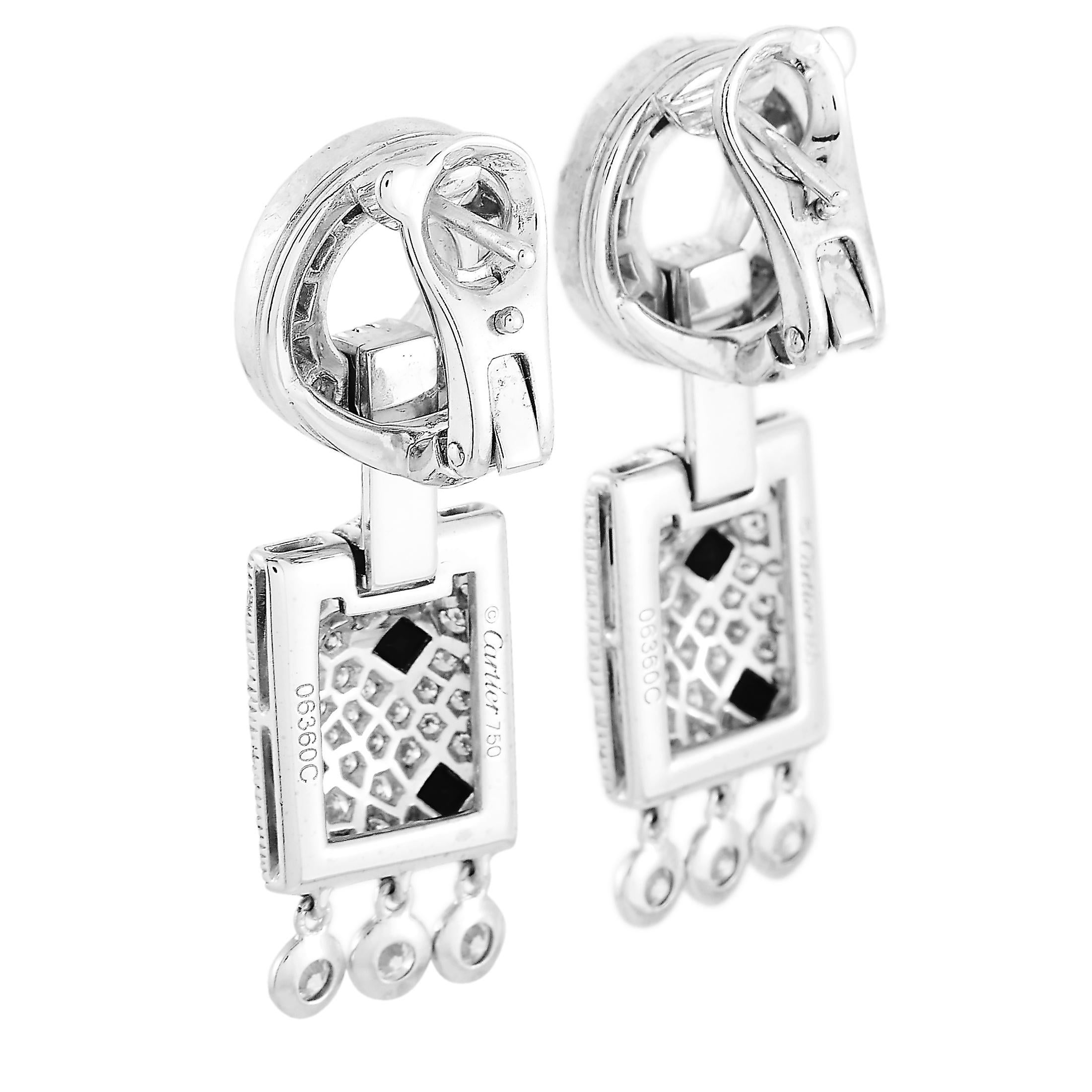 The Cartier “Panthère” earrings are made of 18K white gold and each of the two weighs 8.25 grams. They measure 1.37” in length and 0.65” in width. The pair is embellished with onyxes and with diamond stones that boast F color and VVS clarity and