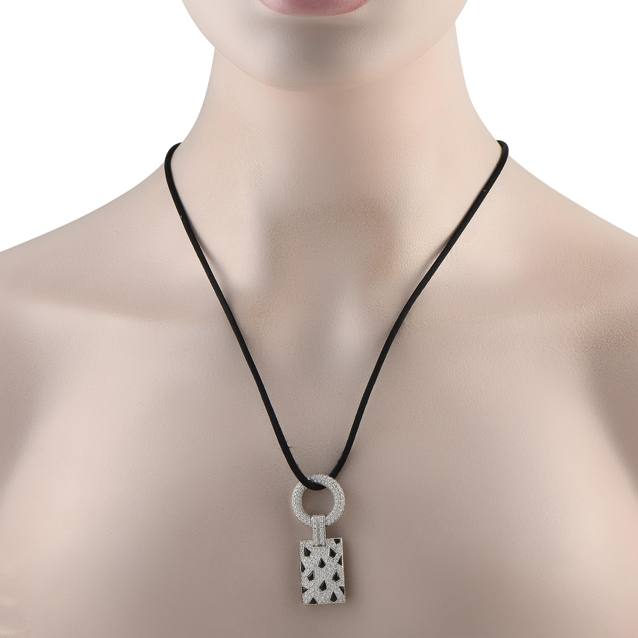 Make a stylish statement with this Cartier Panthere necklace. On the 18K White Gold pendant, Diamonds with a total weight of 2.78 carats effortlessly catch the light. Onyx accents in a subtle feline pattern make it instantly captivating. The pendant