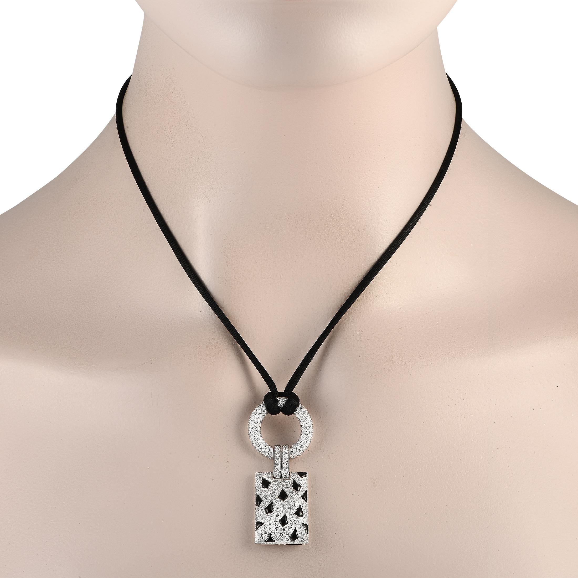 Diamonds with a total weight of 2.85 carats are beautifully juxtaposed with bold Onyx accents on this exquisite Cartier Panthere necklace. Suspended from a 28 cord, youll find a breathtaking 18K White Gold pendant measuring 2.0 long by 0.75