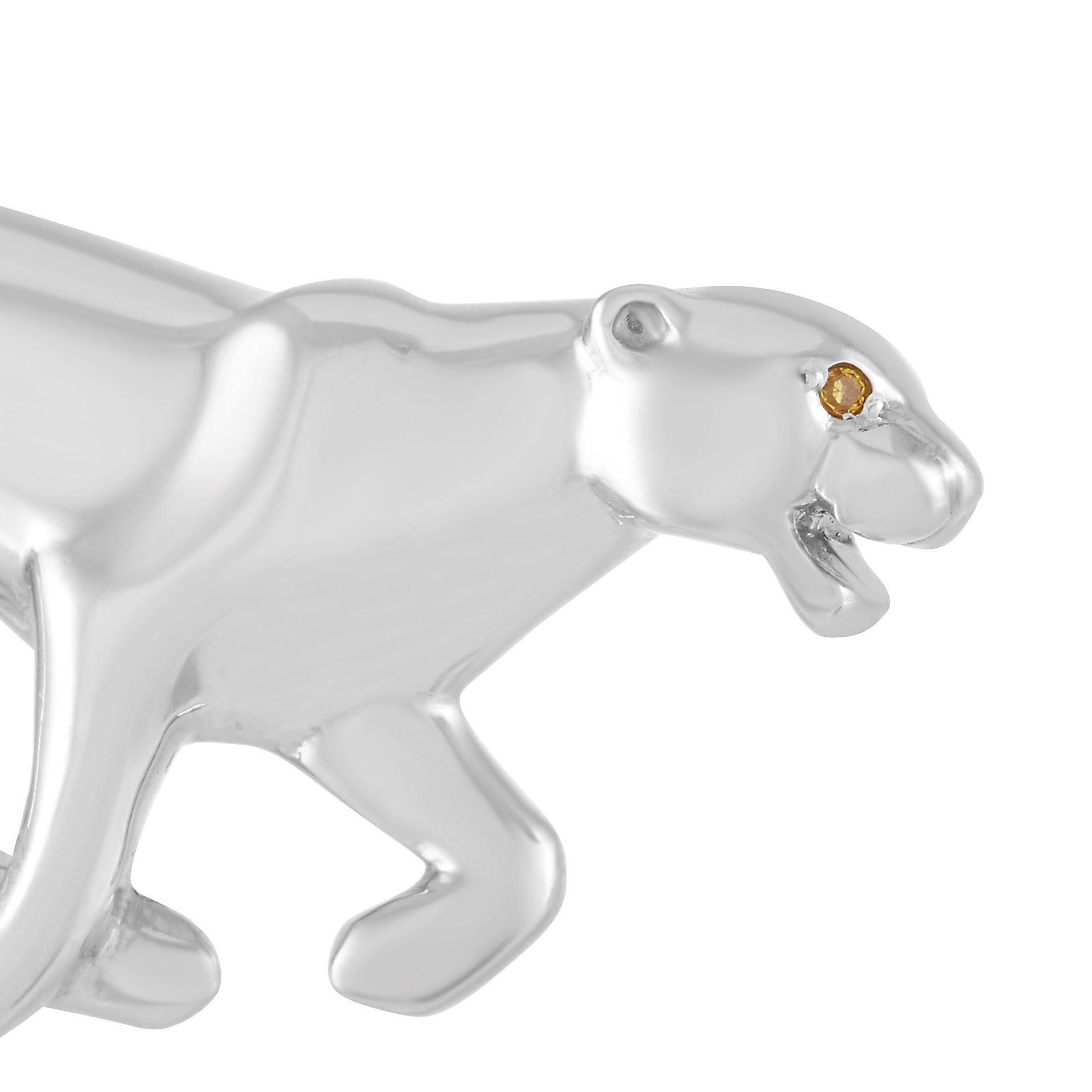 This Cartier 18K White Gold Panthère Brooch is a unique piece. The brooch is made from 18K White Gold in the shape of a panther and set with a round gemstone for the eye. The brooch measures 0.63 inches by 1.38 inches and weighs 10.8 grams.

This