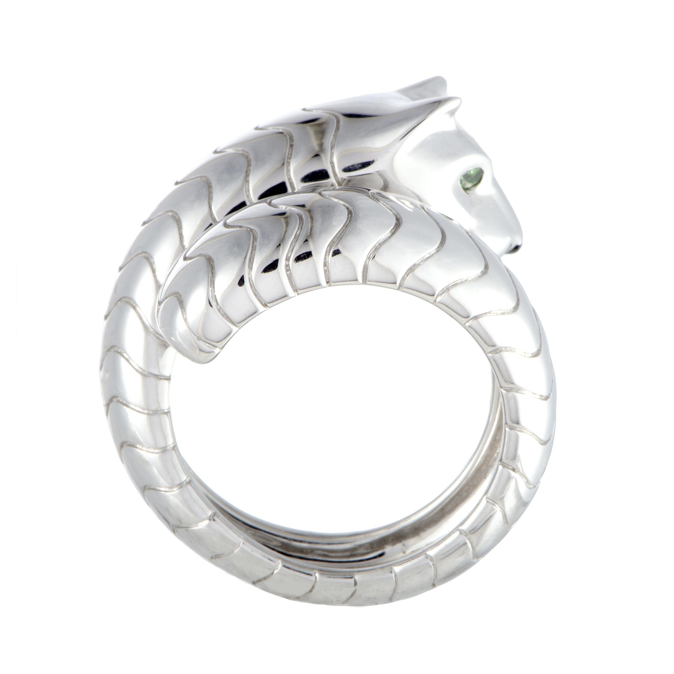 From the iconic “Panthère” collection by Cartier comes this sublime piece made of 18K white gold that boasts superb craftsmanship quality and extraordinary design. The ring is decorated with onyx and tsavorite stones.
 Ring Top Dimensions: 22mm x