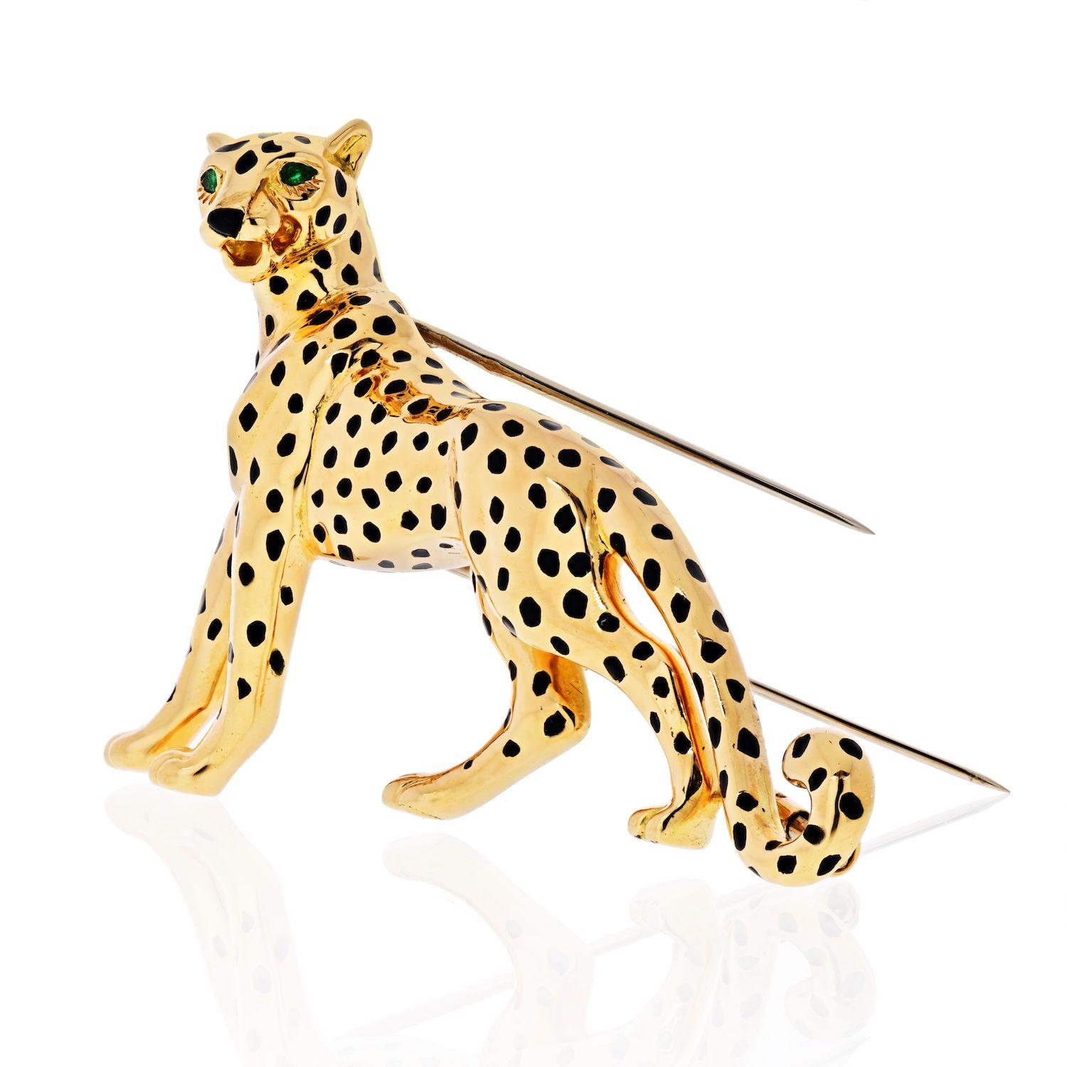 Realistically modelled as a panther, decorated with black enamel spots and pear-shaped emerald eyes, signed Cartier, maker#s mark, numbered, French assay marks, length 6.6cm
