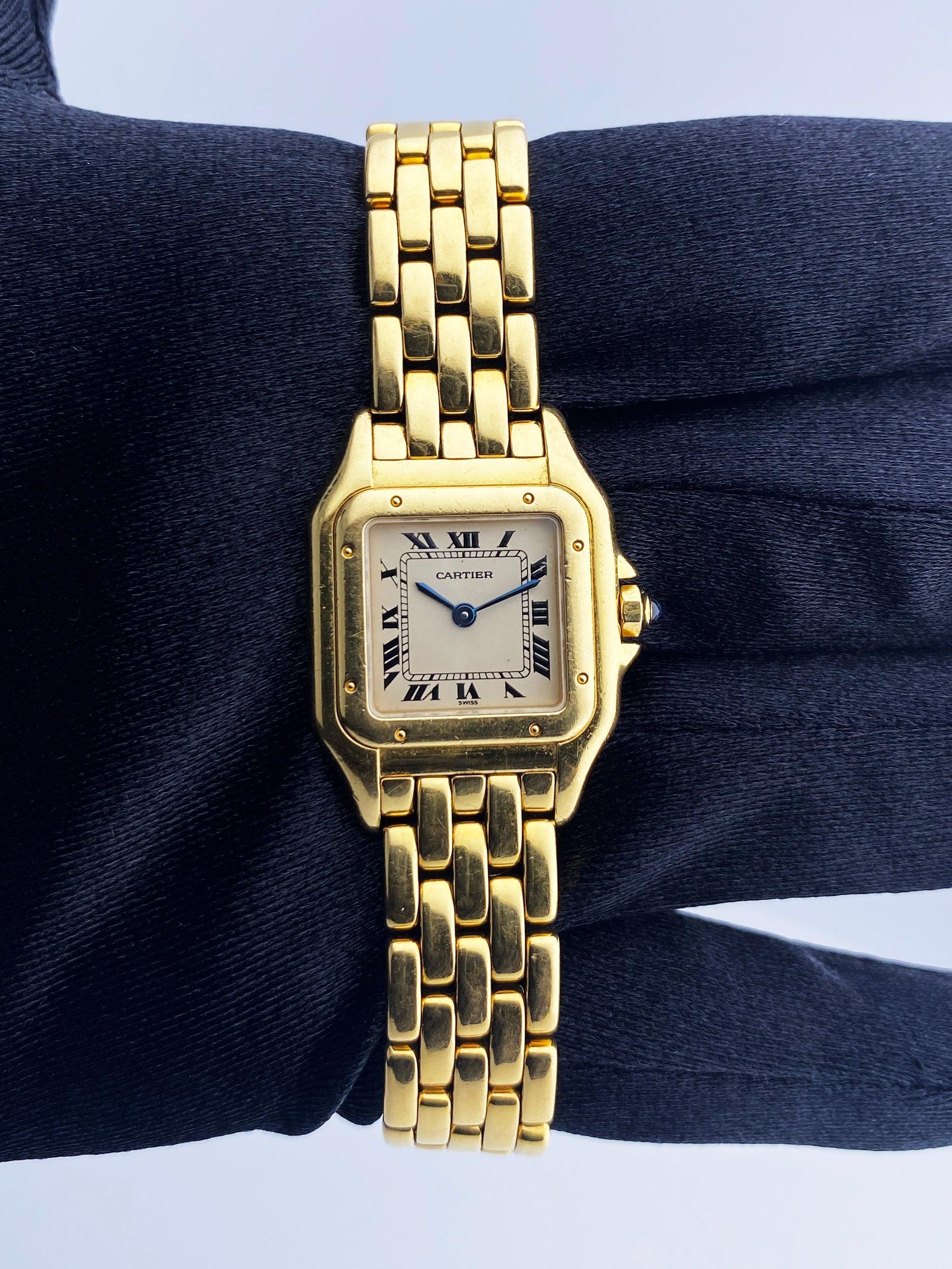 Cartier Panthere Ladies Watch. 22mm 18K yellow gold case. 18K yellow gold smooth bezel. Off-White dial with blue steel hands and Roman numeral hour markers. Minute markers on the inner dial. 18K yellow gold bracelet with hidden butterfly clasp. Will