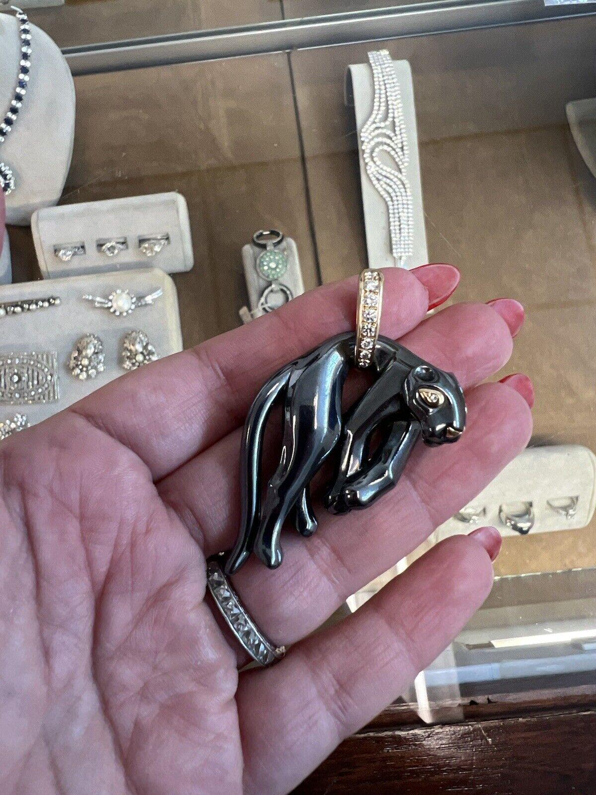 Cartier 18k Yellow Gold, Silverium & Diamond Hanging Panthere Pendant Vintage Circa 1980s

Here is your chance to purchase a beautiful and highly collectible designer pendant.  Truly a great piece at a great price! 

Details:
Size : 2.25