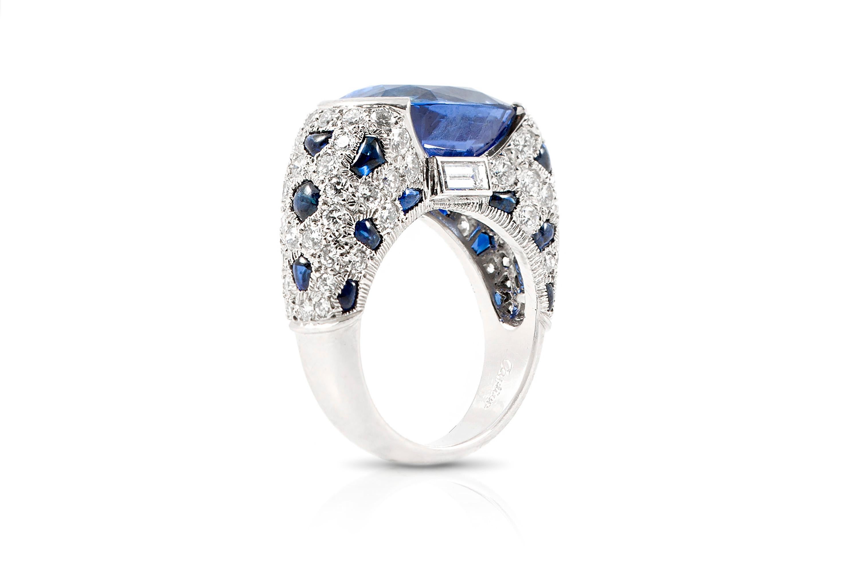 Cartier ring finely crafted in platinum, weighing approximately 13.00 carats of blue sapphires.
A very unique and rare cocktail ring to have.
Signed by Cartier.