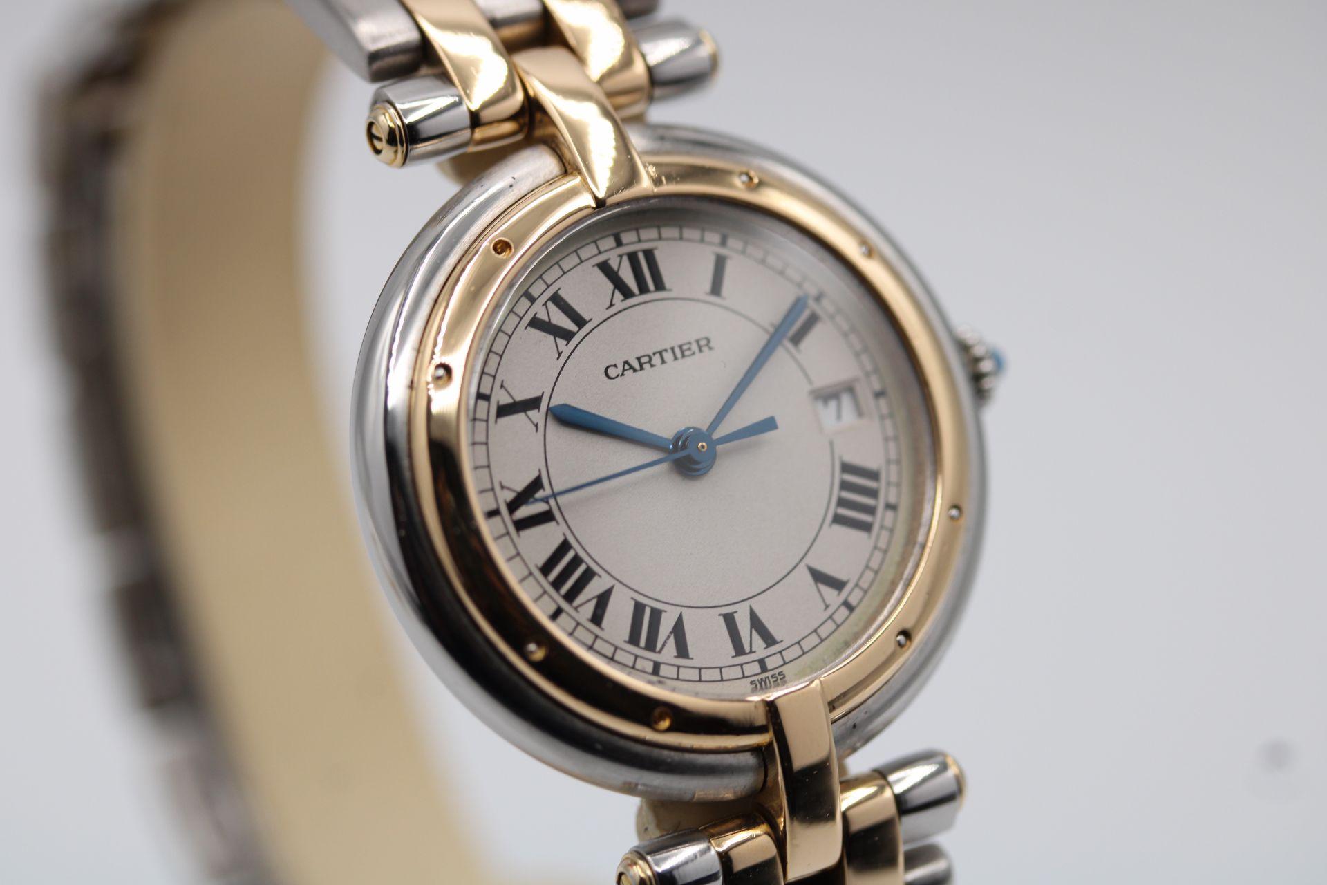 
We have given this a complete service and a polish. The watch is presented with both inner and outer boxes, pouch, wallet, manuals and papers dated 1993.

This Cartier Cougar, model 183964, features a 30mm stainless steel case, fixed gold bezel,