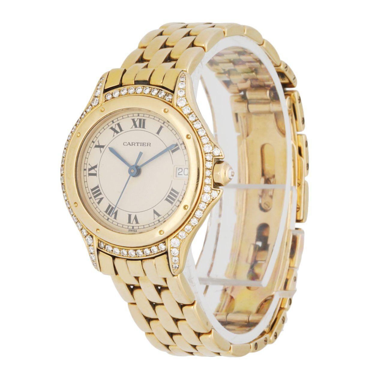 Cartier Panthere Cougar 887907 ladies watch. 26mm 18k yellow gold case with factory set diamonds. 18K yellow gold bezel.Â Cream dial with blue hands and black Roman numeral hour marker. Date display at 3 o'clock position. 18k yellow gold bracelet