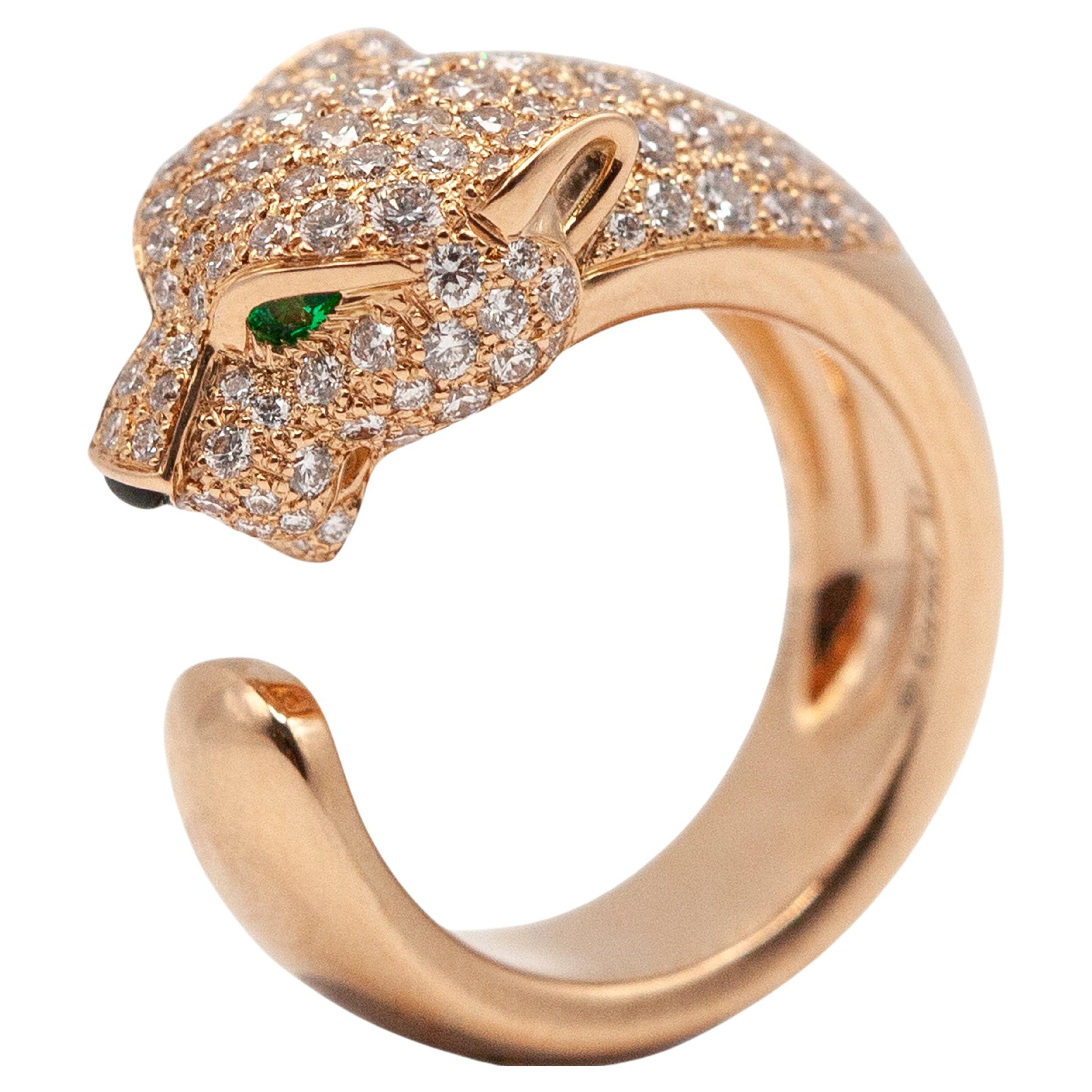 Cartier Panthere 18K rose gold half pave diamond ring set with 137 high quality round brilliant cut diamonds approximate 1.15 carats in E color VVS-VS clarity, 2 pear shape emerald eye and 1 onyx.


With original box, Cartier certificate & purchase