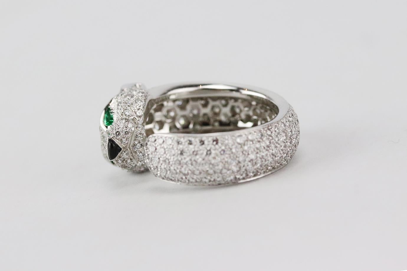 Cartier Panthère de Cartier 18k white gold and diamond ring. Made from white-gold with 285 diamonds totalling 2.39 carats, emeralds eyes and onyx nose. White-gold. Comes with pouch and box. Size: 51 mm. Width: 5 mm
