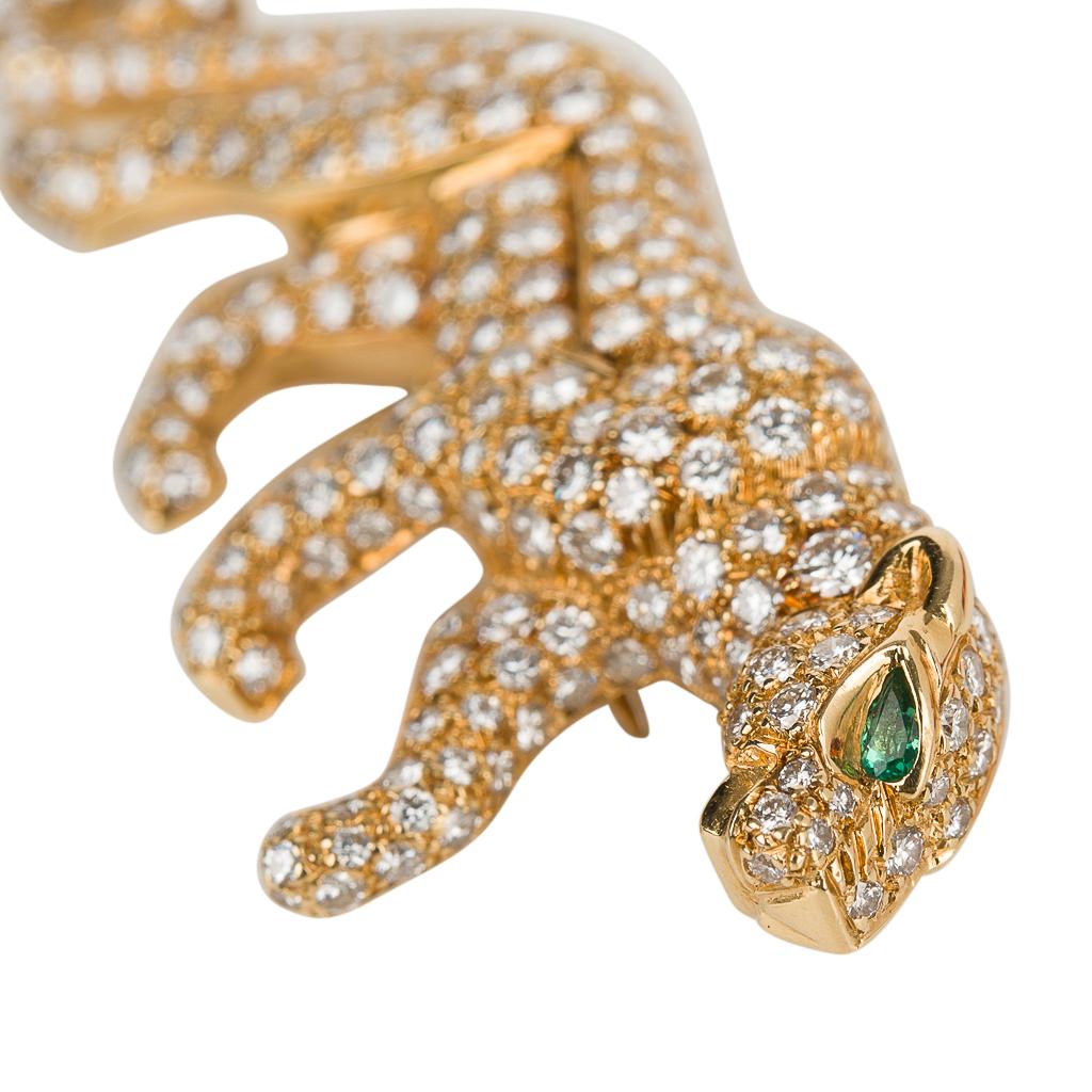 Guaranteed authentic Cartier vintage signed and numbered iconic Panther brooch features 18K yellow gold set with approximately 3.5 carats 
of diamonds.
The diamonds are D to E with VVS clarity.
Limited edition and signed this rare brooch was created