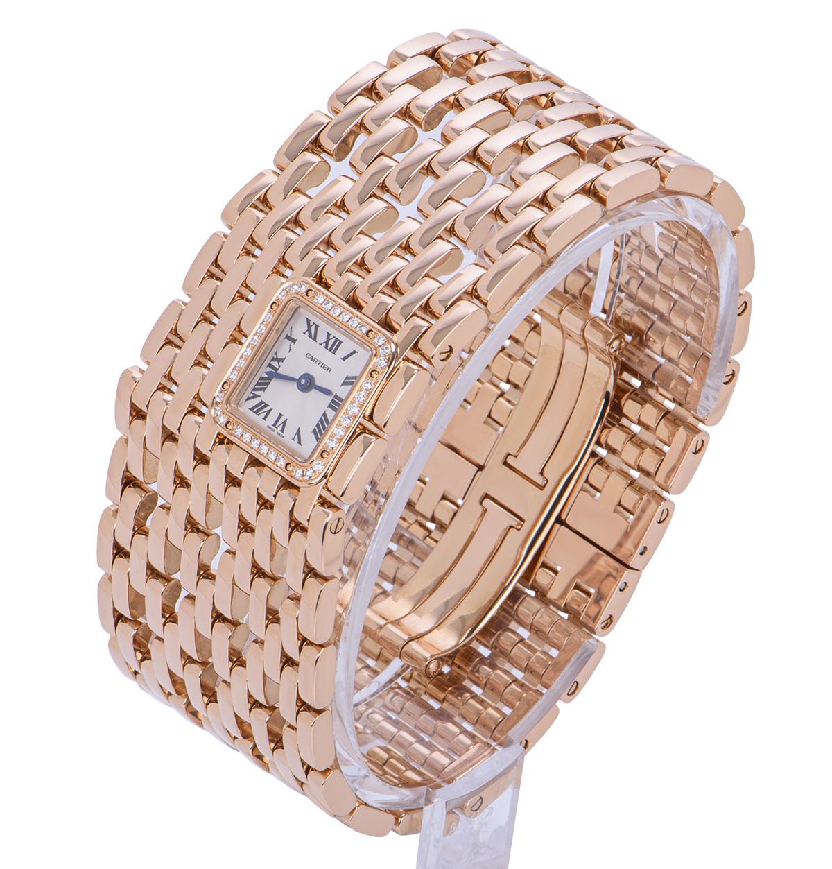 From Cartier's Panthere de Cartier collection, this 31 mm rose gold cuff watch is in unworn condition. Features a silvered dial concealed with sapphire crystal featuring Roman numerals, sword-shaped hands in blued steel and a secret Cartier