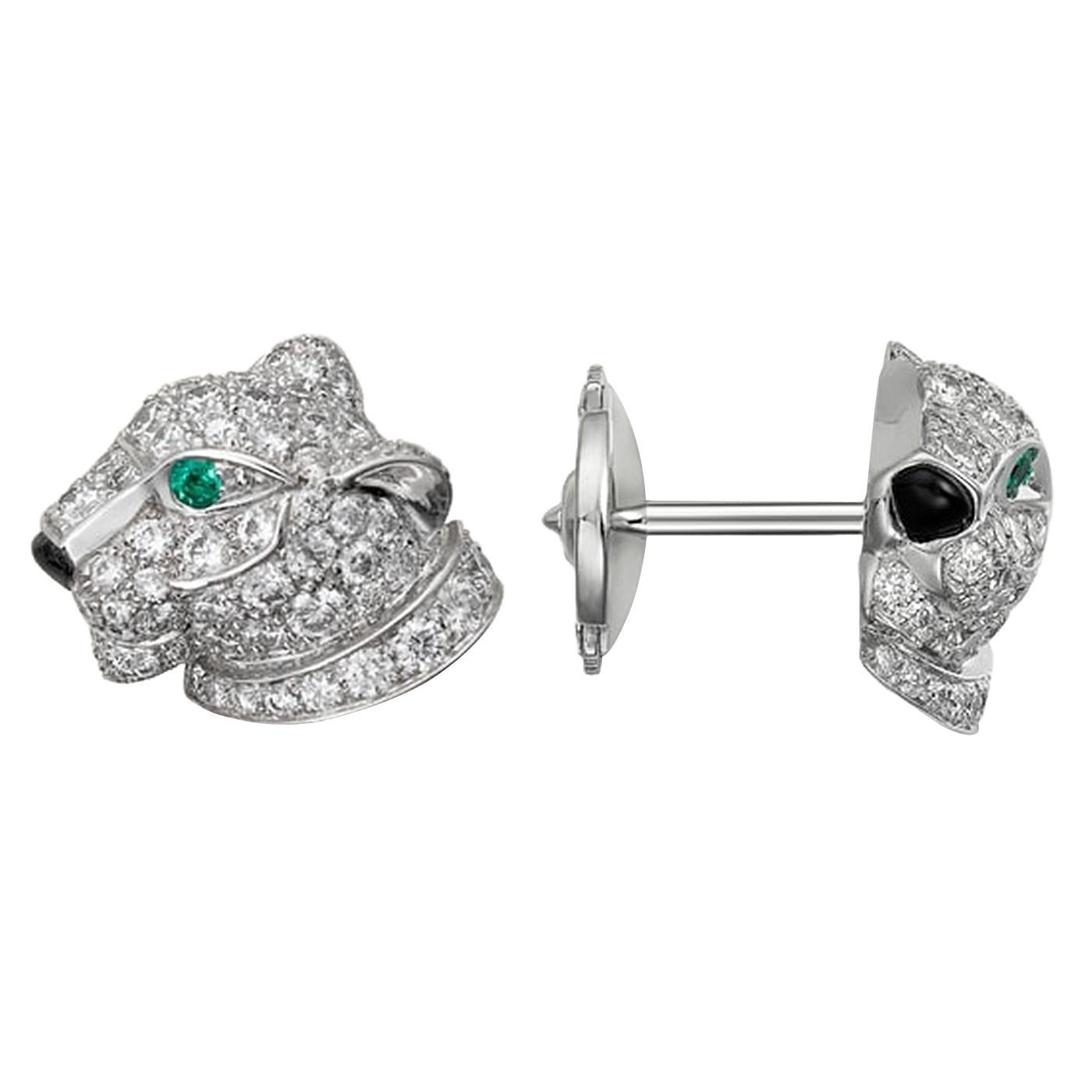 Panthère de Cartier earrings, white gold 750/1000, each set with emeralds, onyx, and 63 brilliant-cut diamonds totalling 0.77 carats. Width of the motif: 12.7 mm. Thickness of the motif: 4.64 mm. The Cartier panther first leapt into the Maison's