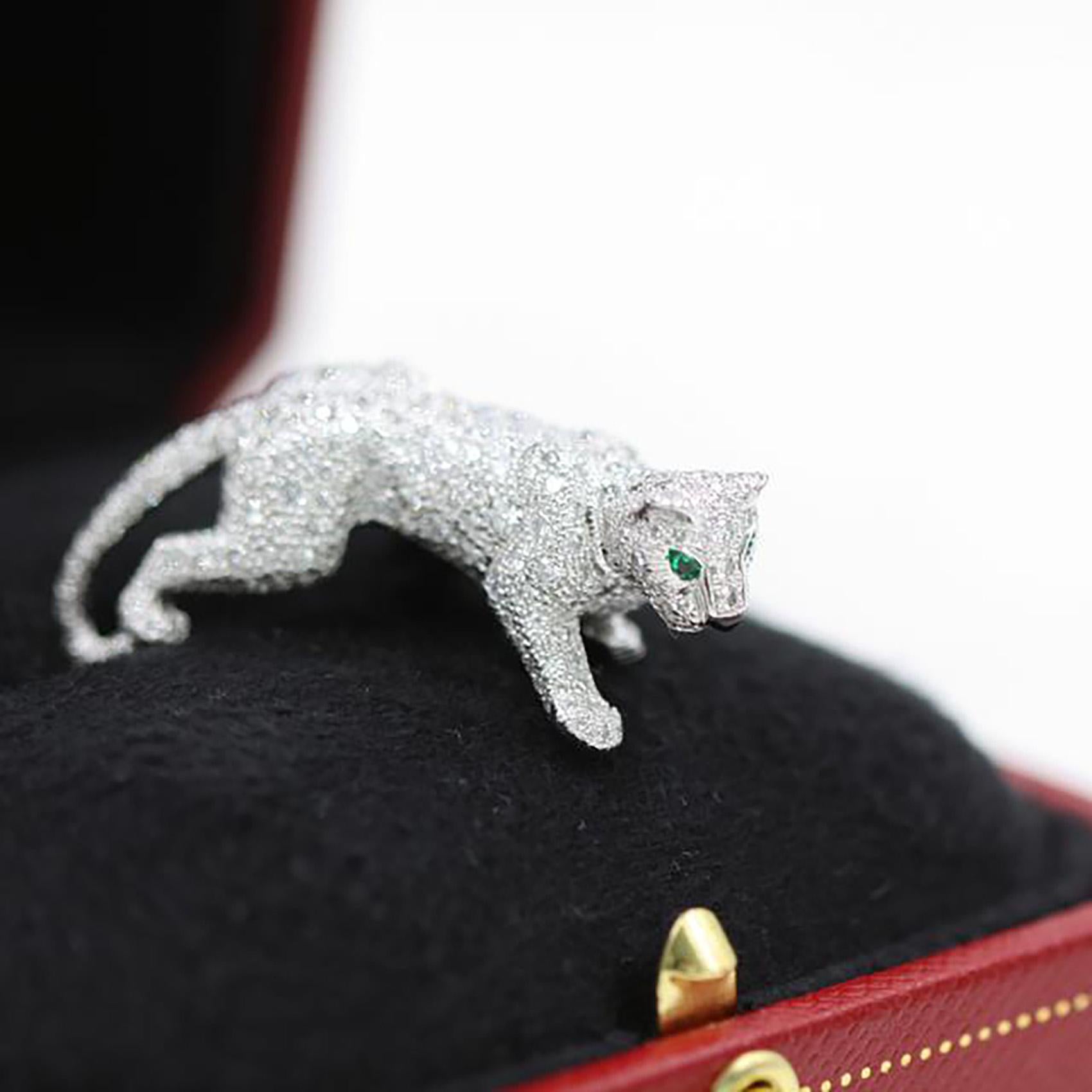 Designer: Cartier
Collection: Panthere de Cartier
Metal: White Gold
Metal Purity: 18k
Stones: Round Brilliant Cut Diamonds, Onyx, Emerald
Ring Size: 49 (euro) ; 4.75 (US)

The panther, the symbolic animal of Cartier, made its first appearance in the