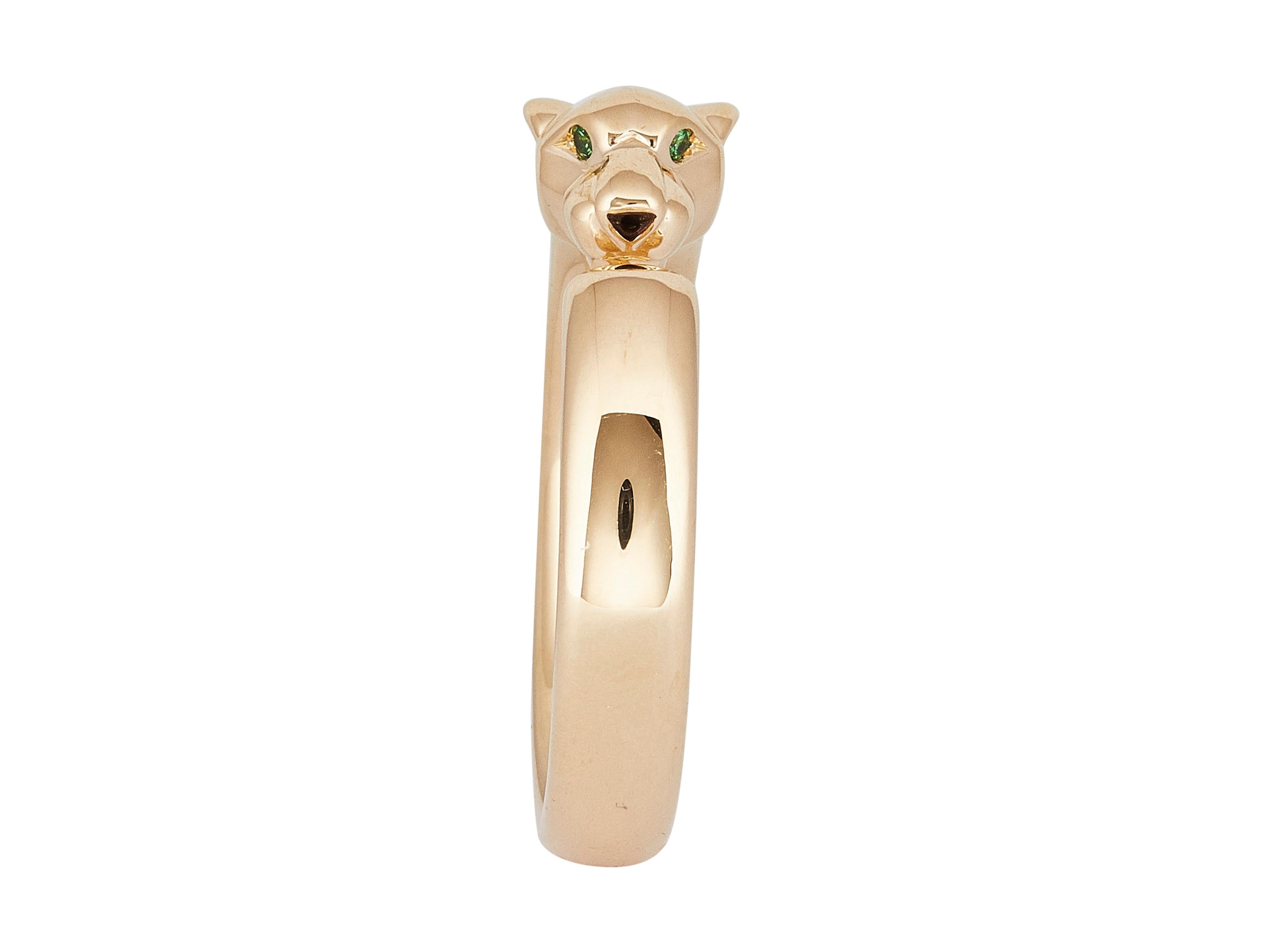 The bracelet: A Cartier Panthère de Cartier Ring in eighteen karat Yellow Gold set with tsavorite garnet eyes and an onyx nose.

Accompanied by…
Service paper

The ring is in excellent condition, with only a few minor scratches that are expected