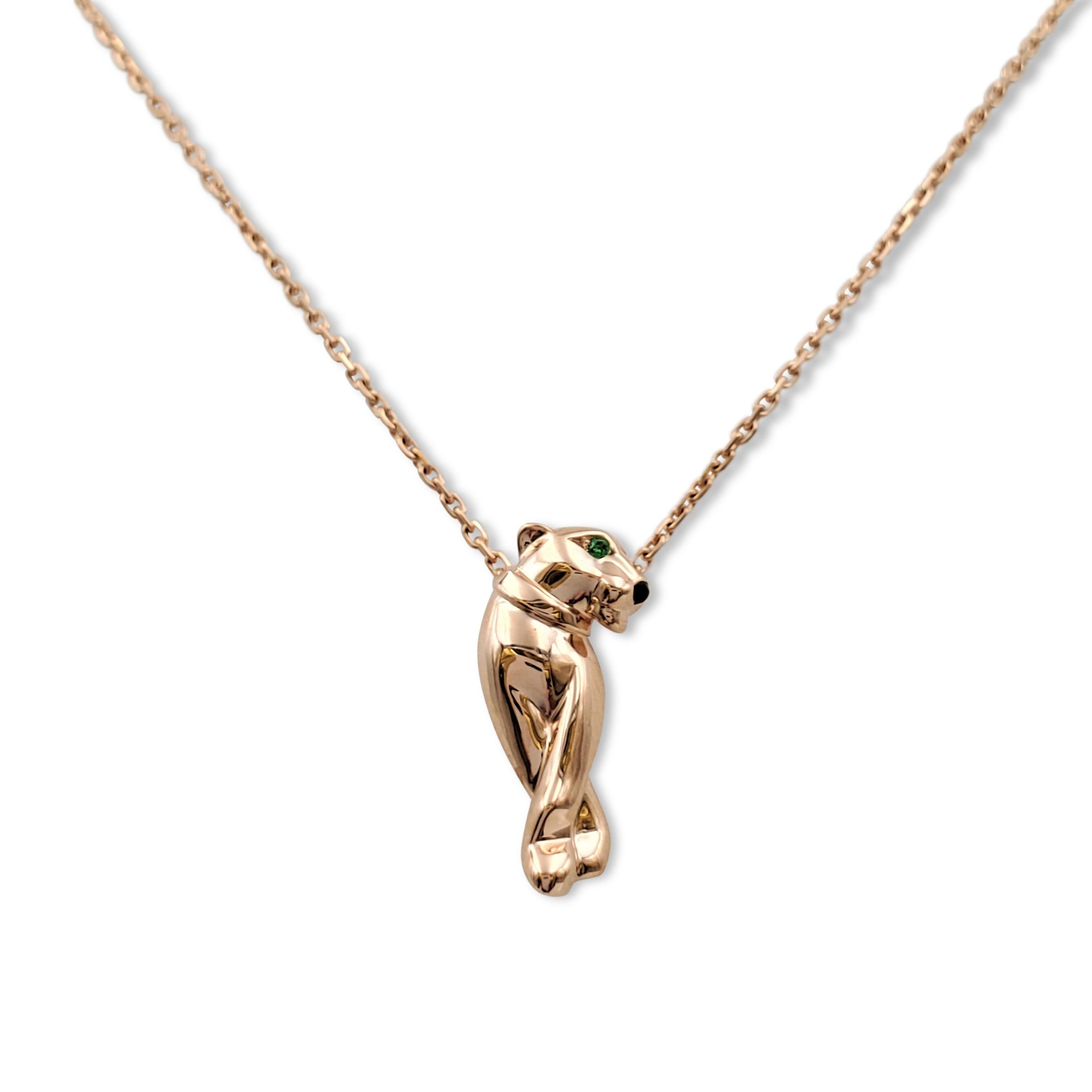 Authentic Cartier 'Panthère de Cartier' pendant necklace crafted in 18 karat rose gold centers on a panther, the symbolic animal of Cartier, set with lively tsavorite garnet eyes and an onyx nose. Signed Cartier, Au750, with serial number and