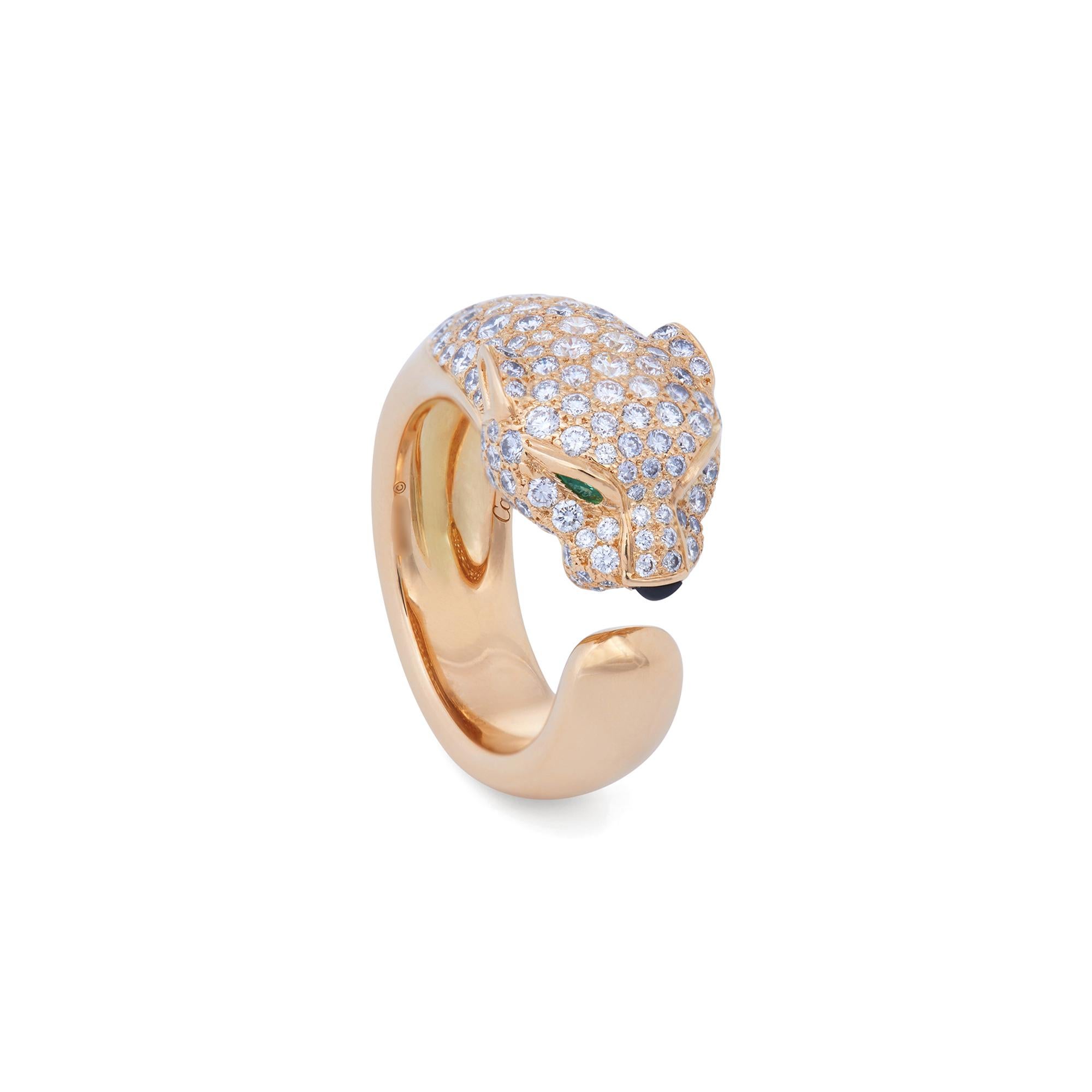 Authentic Panthère de Cartier ring crafted in 18 karat yellow gold and set with approximately 1.15 carats of round brilliant cut diamonds (E-F color, VS clarity) throughout the head and of mane of the panther. The panther head is completed with