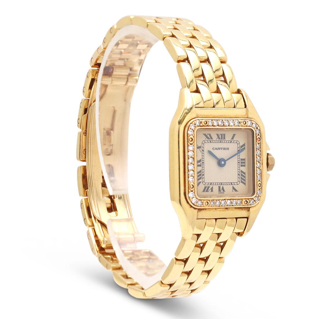 Authentic Cartier 'Panthère de Cartier' ladies watch crafted in 18 karat yellow gold. The case measures 30mm x 22mm with original diamond bezel and diamond-set crown, ivory dial, blue steel sword-shaped hands, and Roman Numeral hour markers. The 18