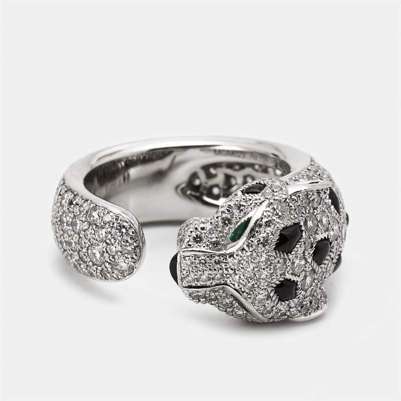 Embrace opulence with the Cartier Panthere De Cartier ring. Crafted with meticulous attention to detail this exquisite piece features a sleek white gold band with the House animal majestically incorporated. The ring is adorned with radiant diamonds