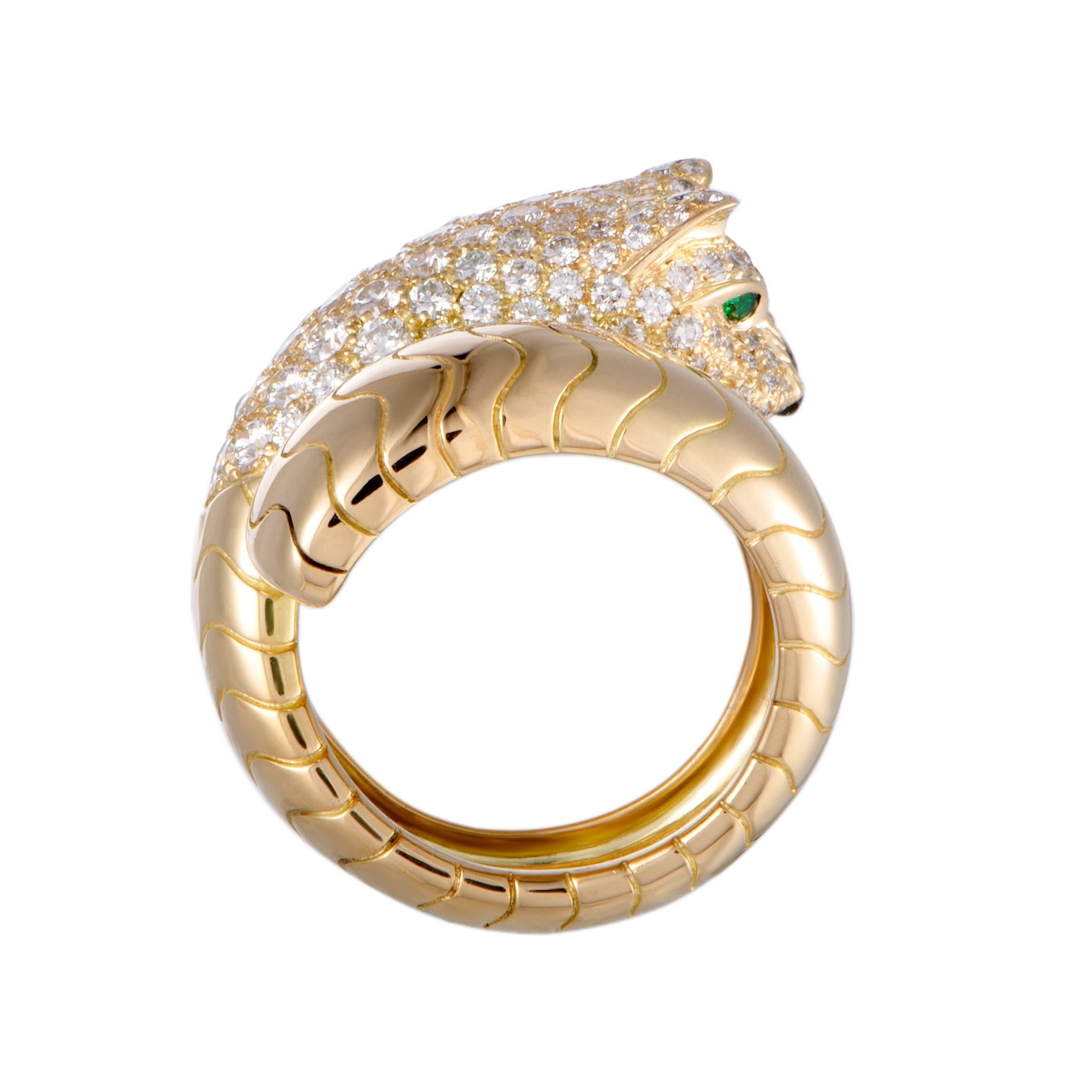 Depicting a panther in a fabulously luxurious manner, this stunning Cartier ring offers an incredibly eye-catching appearance. The ring is crafted from 18K yellow gold and embellished with onyx, emerald, and diamond stones.

Ring Size: 6.5
Band