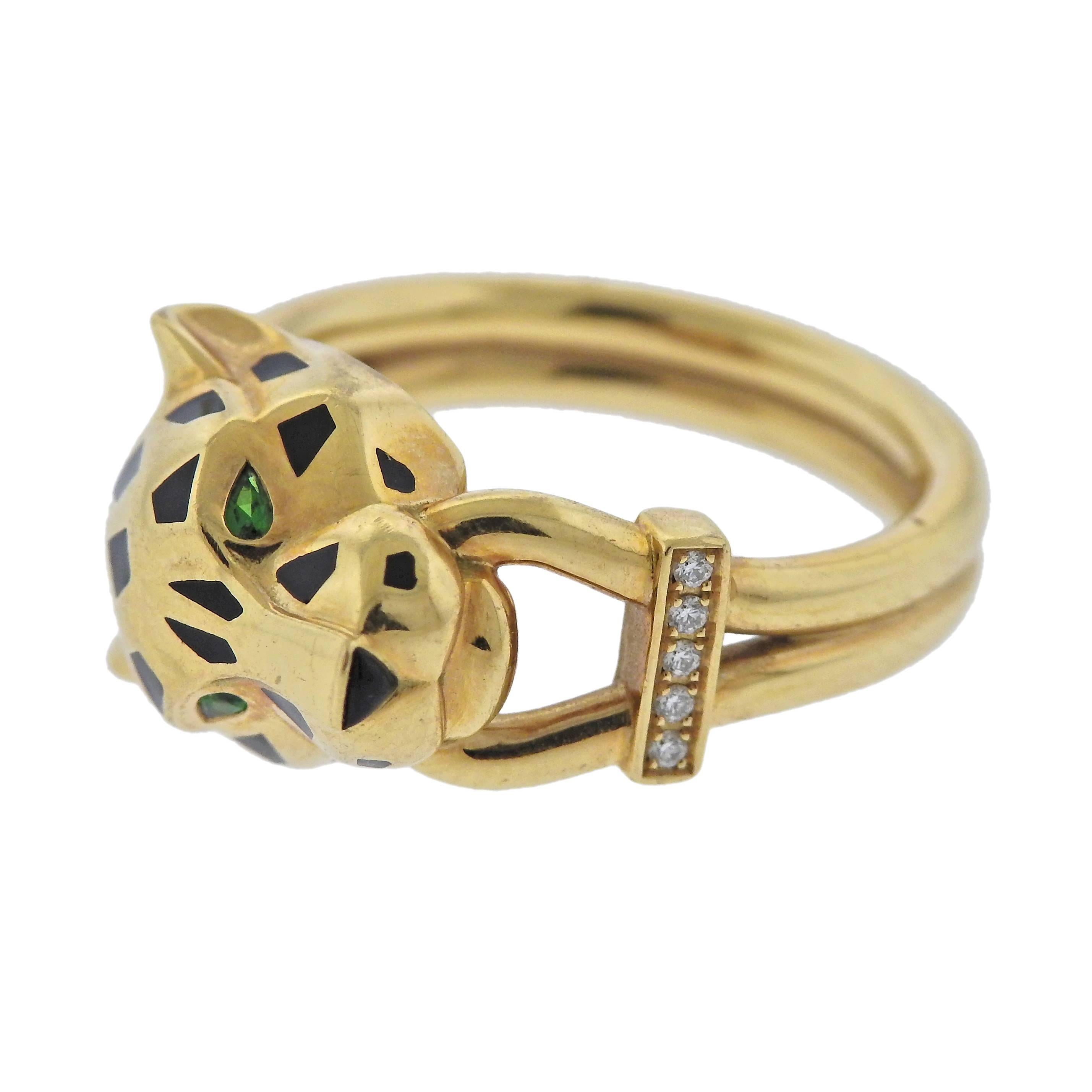 Pathere de Cartier 18k gold ring, designed by Cartier, decorated with black enamel, tsavorite garnet eyes and 0.02ctw G/VS diamonds. Retail $7550. Comes with box and COA. Ring size - 6.25, ring top (panther head) measures 10.7mm x 13.7mm, weighs