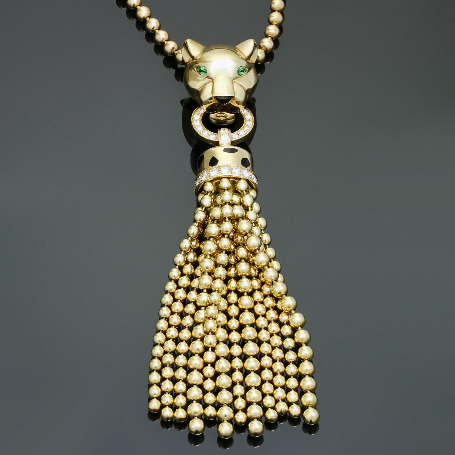 This iconic Panthère de Cartier necklace is crafted in 18k yellow gold and features a gorgeous panther enhancer pendant with a tassel, set with 36 brilliant-cut diamonds of an estimated 0.24 carats, tsavorite garnets, onyx, and black lacquer.