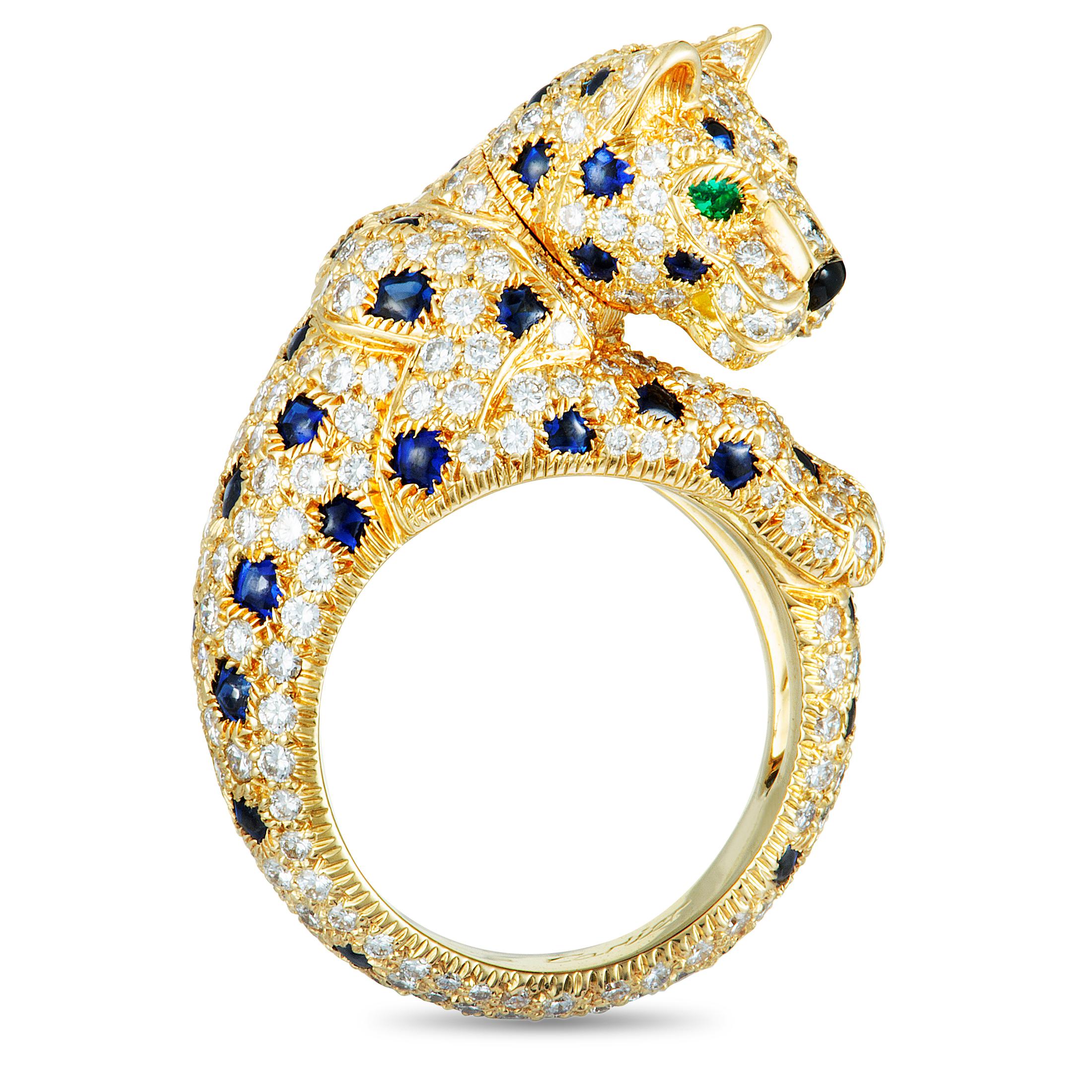 This stunning rare piece from Cartier’s iconic “Panthère” collection is masterfully crafted from luxurious 18K yellow gold whose enticing radiance is accentuated by a plethora of attractive gems. The ring is embellished with diamonds, sapphires,
