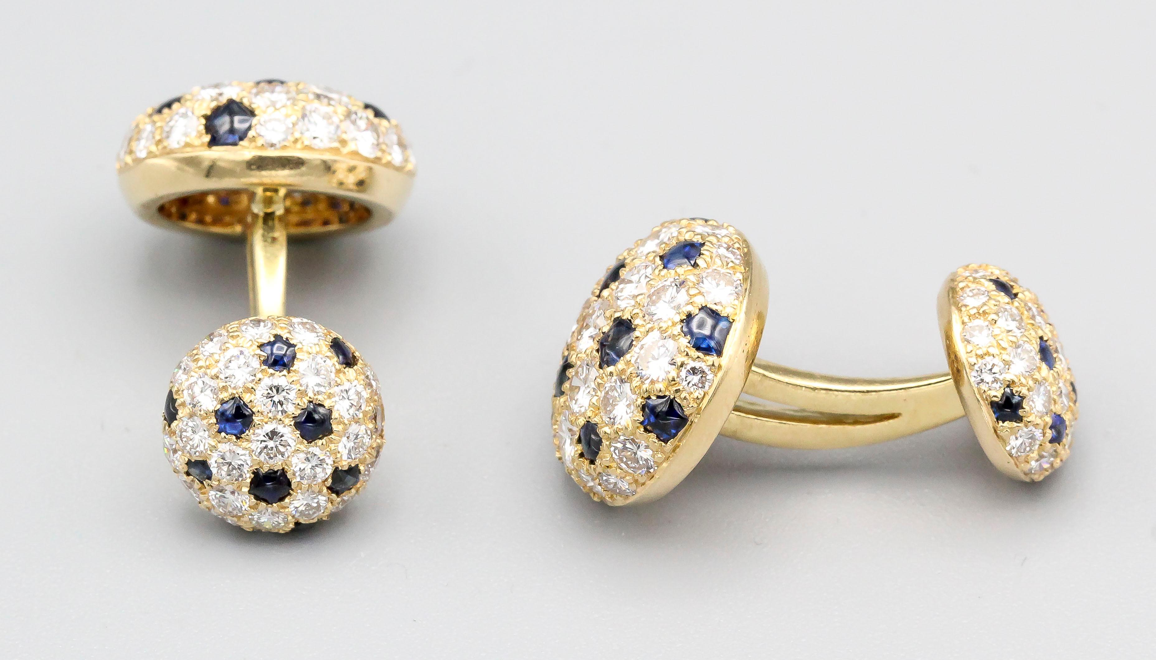 Elegant diamond, blue sapphire and 18K yellow gold button cufflinks from the Panthere collection, by Cartier . They feature high grade round brilliant cut diamonds as well as rich blue sapphires. Circa 1980s.

Hallmarks: Cartier, 750, reference
