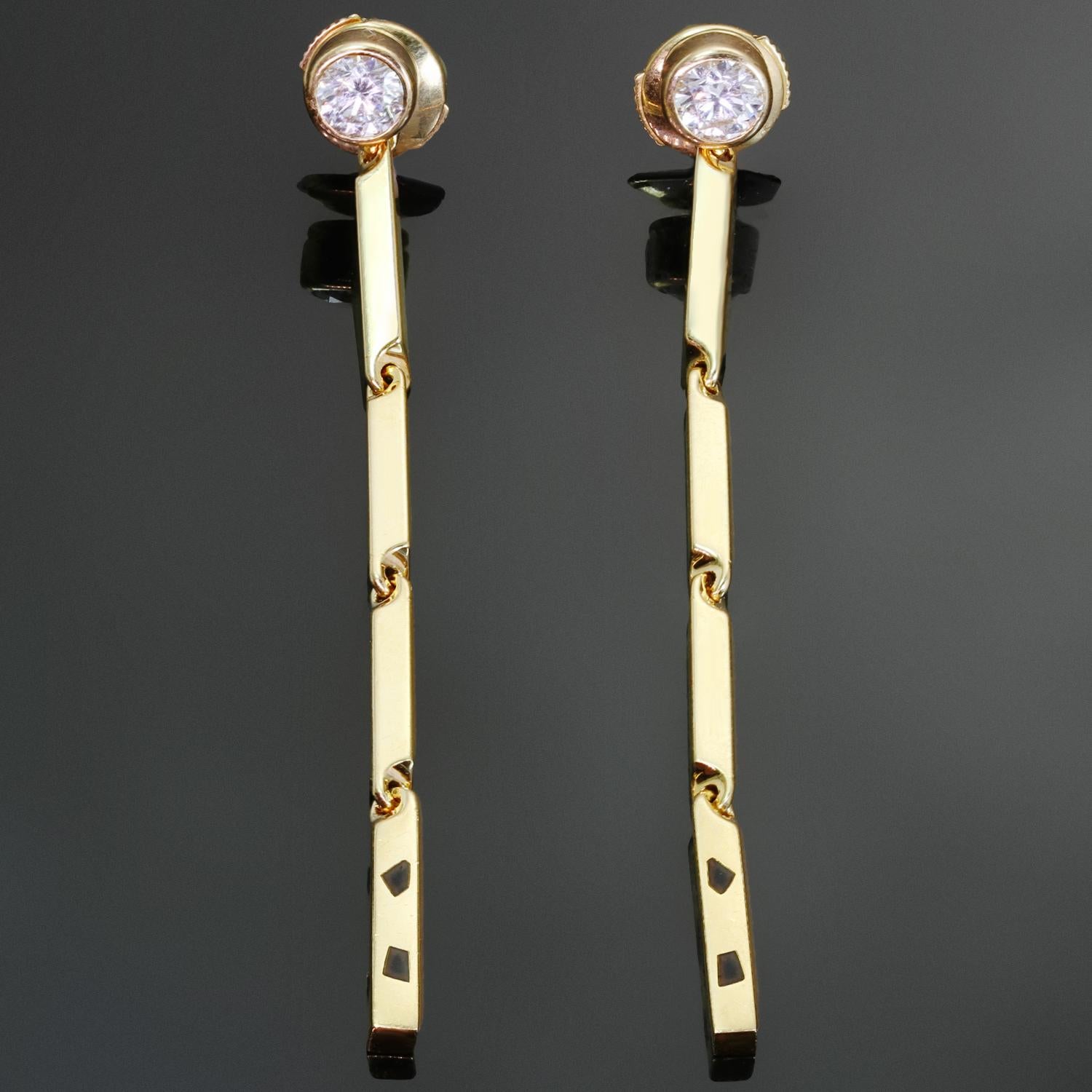 These fabulous Cartier drop earrings from the chic Panthere collection are crafted in 18k yellow gold, set with round brilliant D-E-F VVS1-VVS2 diamonds weighing an estimated 0.60 carats and accented with black lacquer. Made in France circa 2010s.