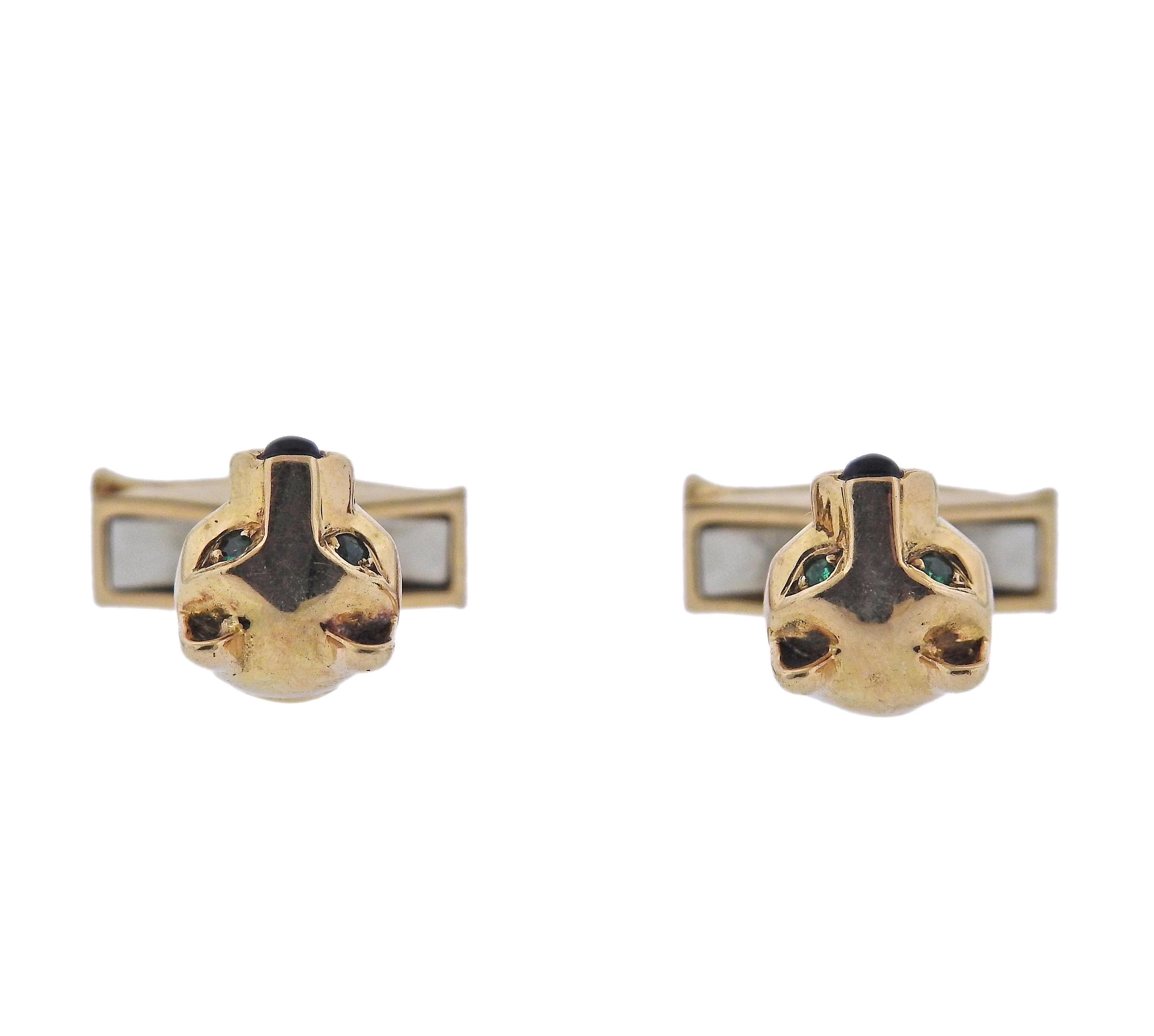 Pair of 18k gold Cartier Panthere cufflinks, with emerald eyes and onyx nose. Each head measures 11mm x 10mm. Marked: French marks, Cartier, 701678. Weight - 13 grams.