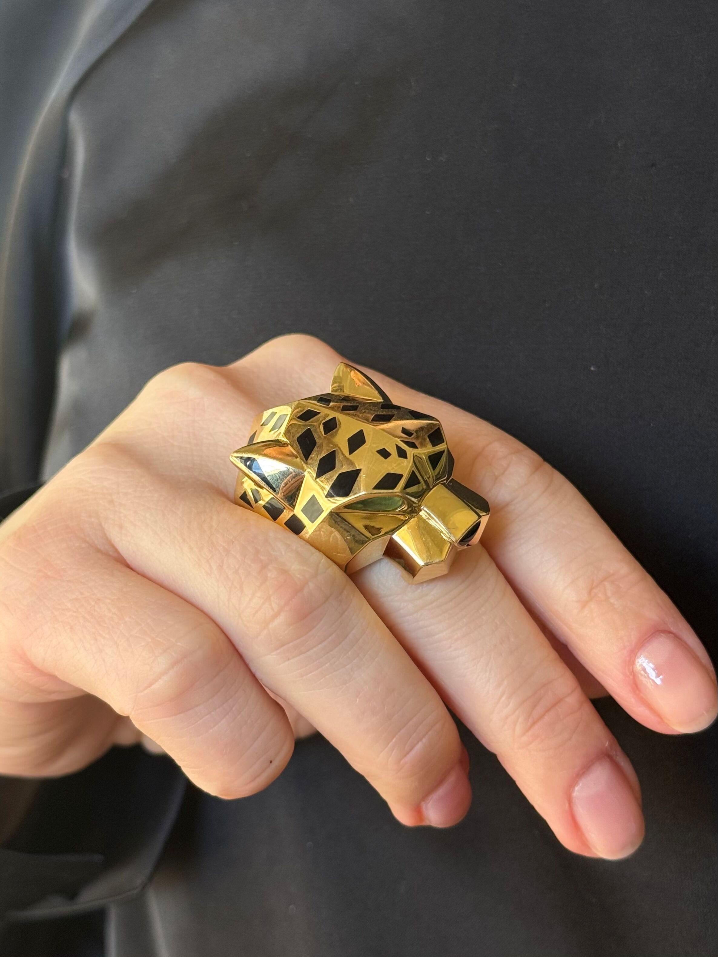 Large 18k yellow gold Panthere de Cartier ring, with peridot eyes, onyx nose and black enamel. 
Ring size 11 (EU66), top is 1.5