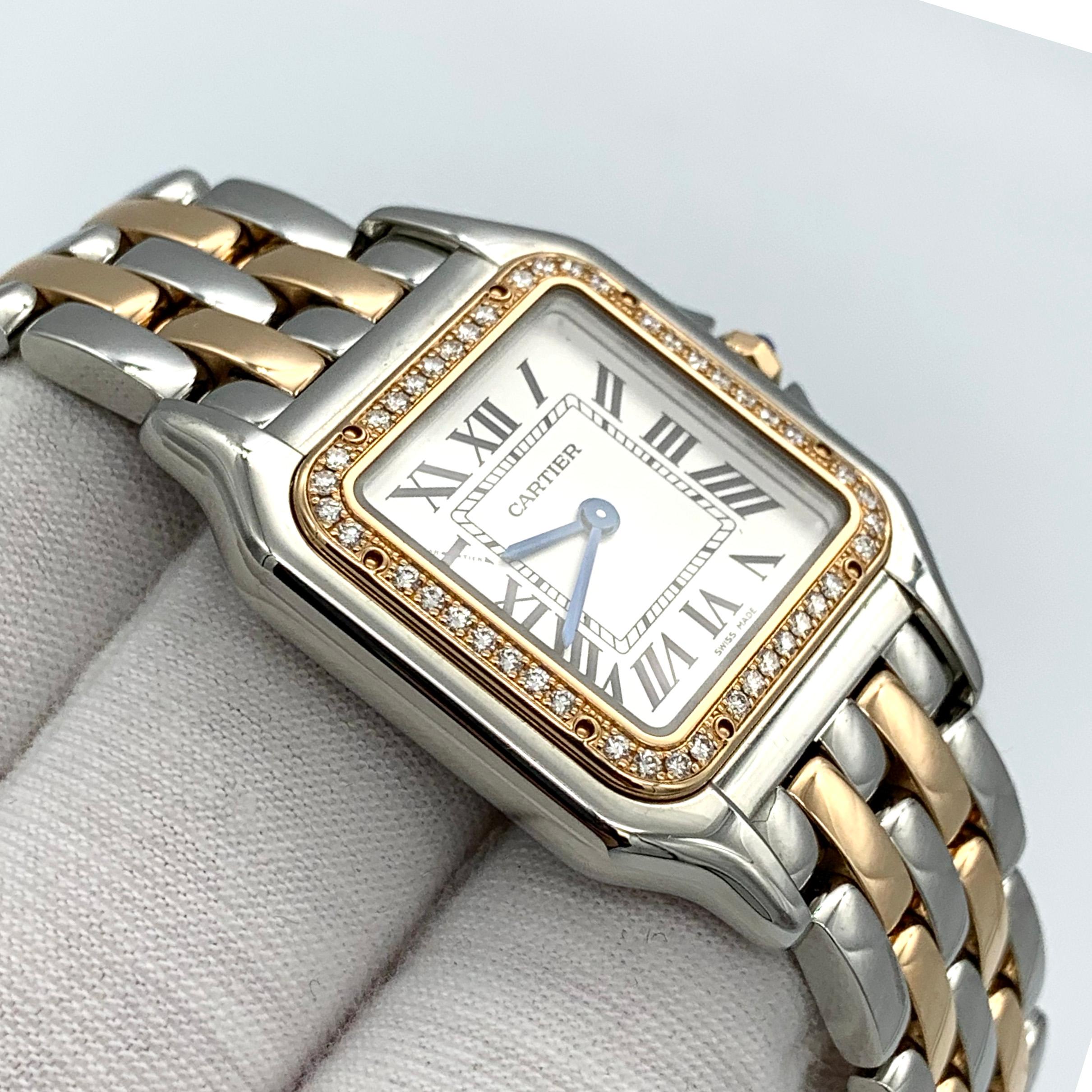 Panthère de Cartier watch, medium model, quartz movement. Case in rose gold 750/1000 and steel, bezel set with brilliant-cut diamonds, dimensions: 29 mm x 37 mm, thickness: 6 mm, crown set with a synthetic blue spinel, silvered dial, blued-steel
