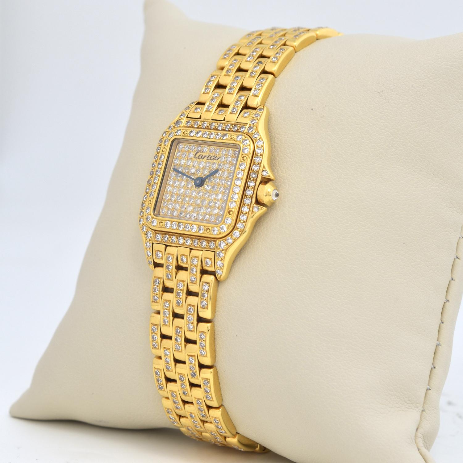 Brand: Cartier

Model Name: Panthere

Ref: 887968

Movement: Quartz 

Case Size: 22mm x 30mm

Case Material: Yellow Gold

Dial: White

Bezel: Yellow Gold 

Hour Markers: Roman Numerals

Bracelet:  Yellow Gold

Features: Hours, Minutes, Seconds,
