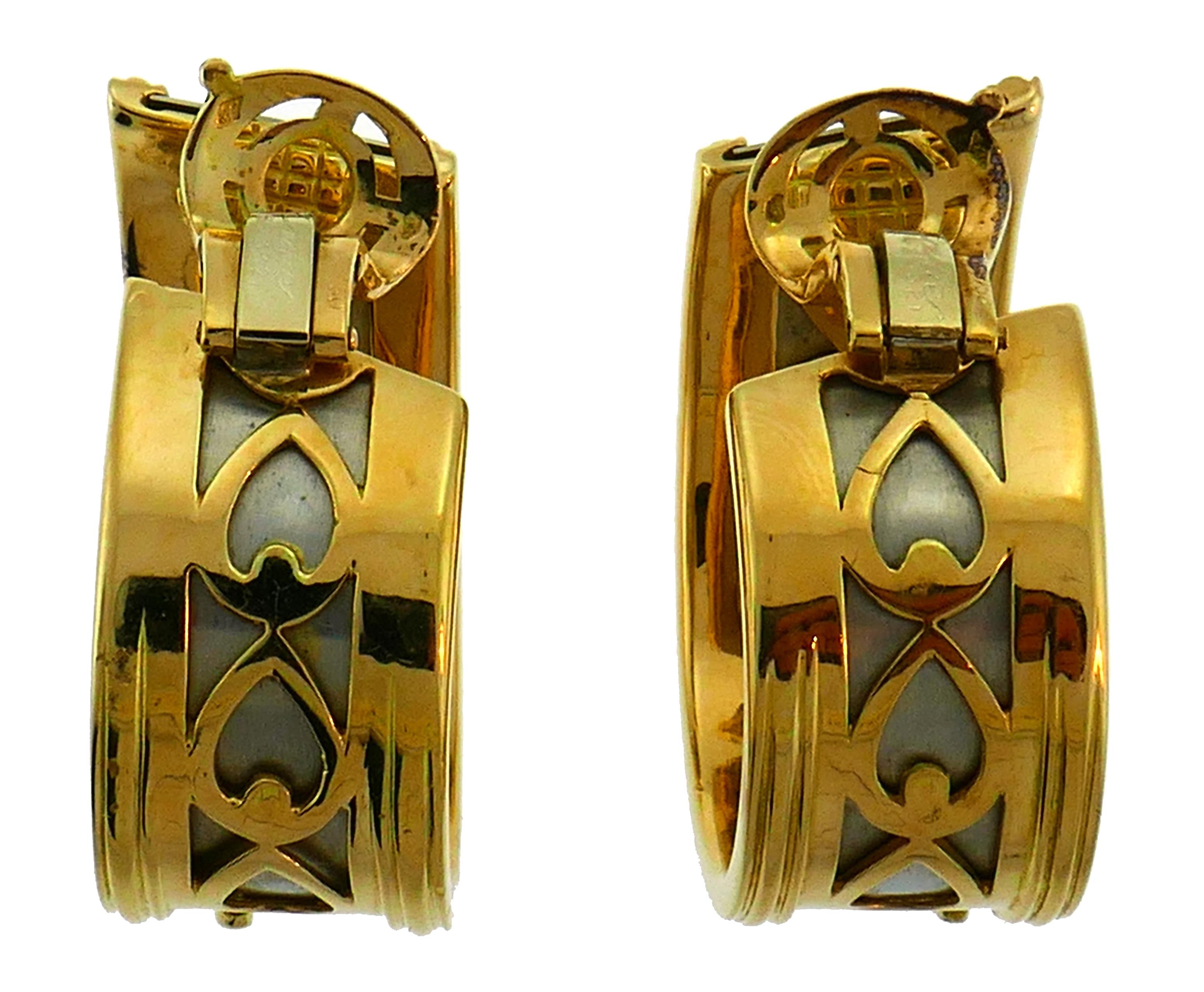 Signature Cartier Panthere Collection pair of hoop earrings. Bold, elegant and wearable, the earrings are a great addition to your treasure box. 
The earrings are made of 18 karat yellow and white gold. 
They measure 1-3/8 x 1/2 inches (3.4 x 1.4