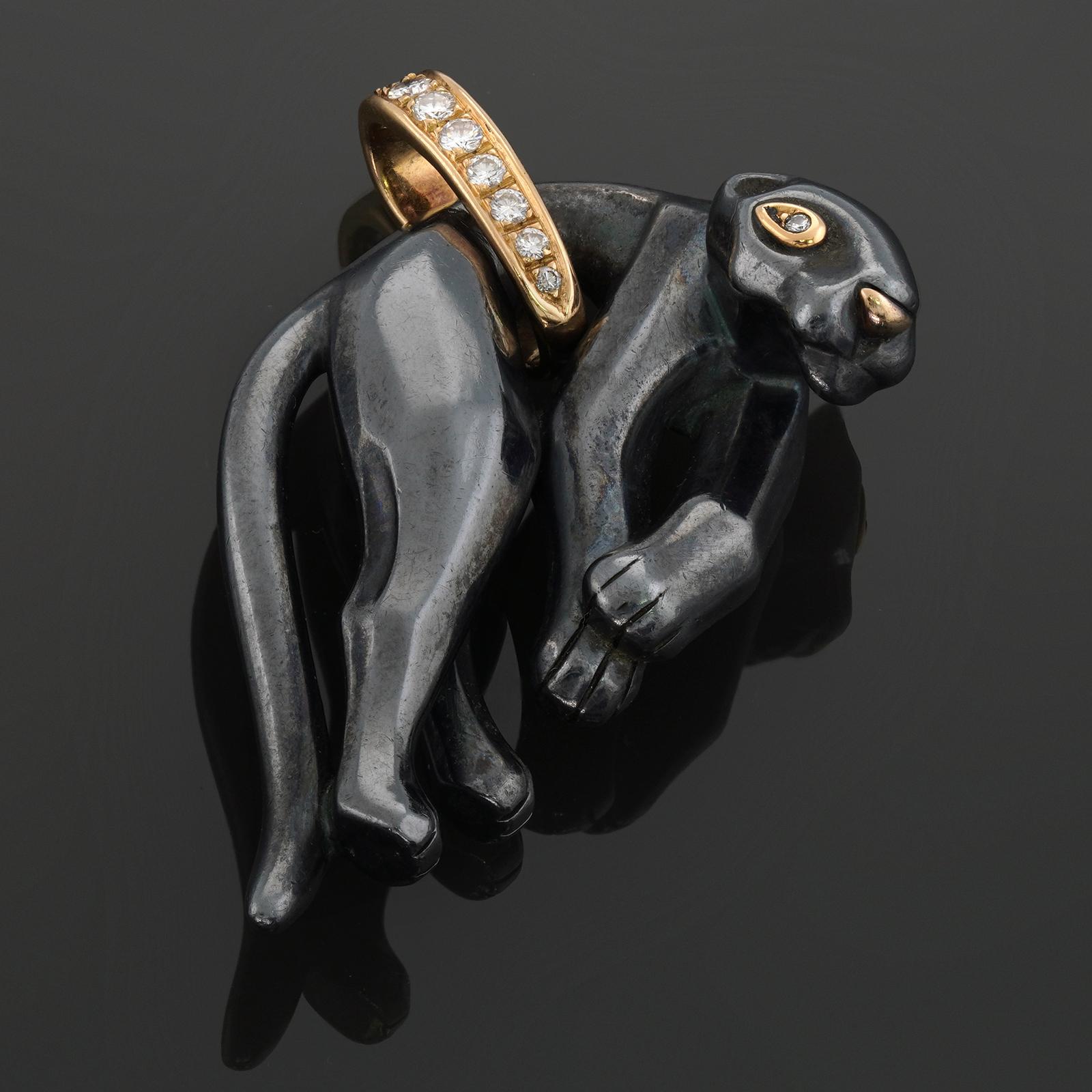 This gorgeous vintage authentic Panthere De Cartier pendant features a black panther crafted in hematite and yellow gold and set with brilliant-cut round F-G VVS diamonds weighing an estimated 0.20 carats. Made in France circa 1980s. Measurements: