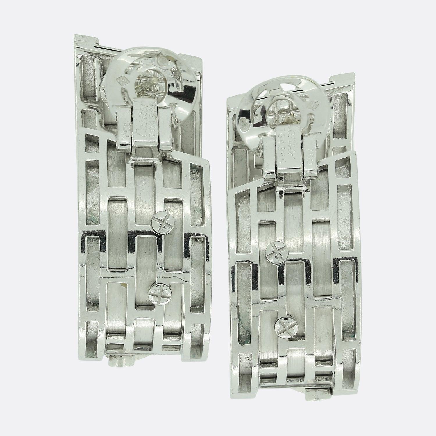Here we have a wonderful pair of large hooped earrings from the world renowned luxury jewellery house of Cartier. Each 18ct white gold piece depicts a pair of walking panthers atop a matte finished backdrop and plain high-polish finished edges. 