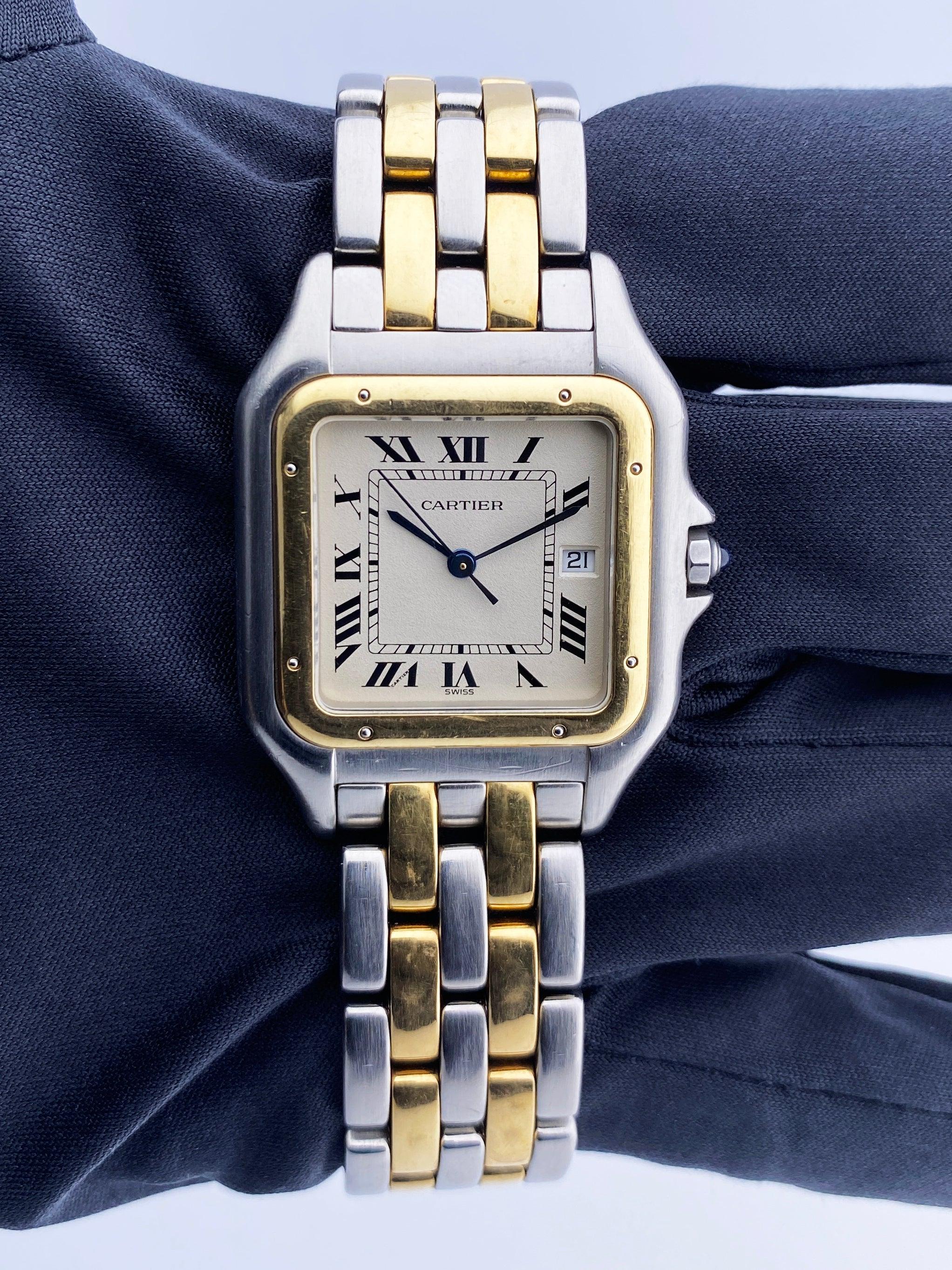 Cartier Panthere Jumbo Mens Watch. 29mm stainless steel case with 18K yellow gold smooth bezel. Off-White dial with blue steel hands and black Roman numeral hour markers. Minute markers on the inner dial. Date display at the 3 o'clock position. 18k