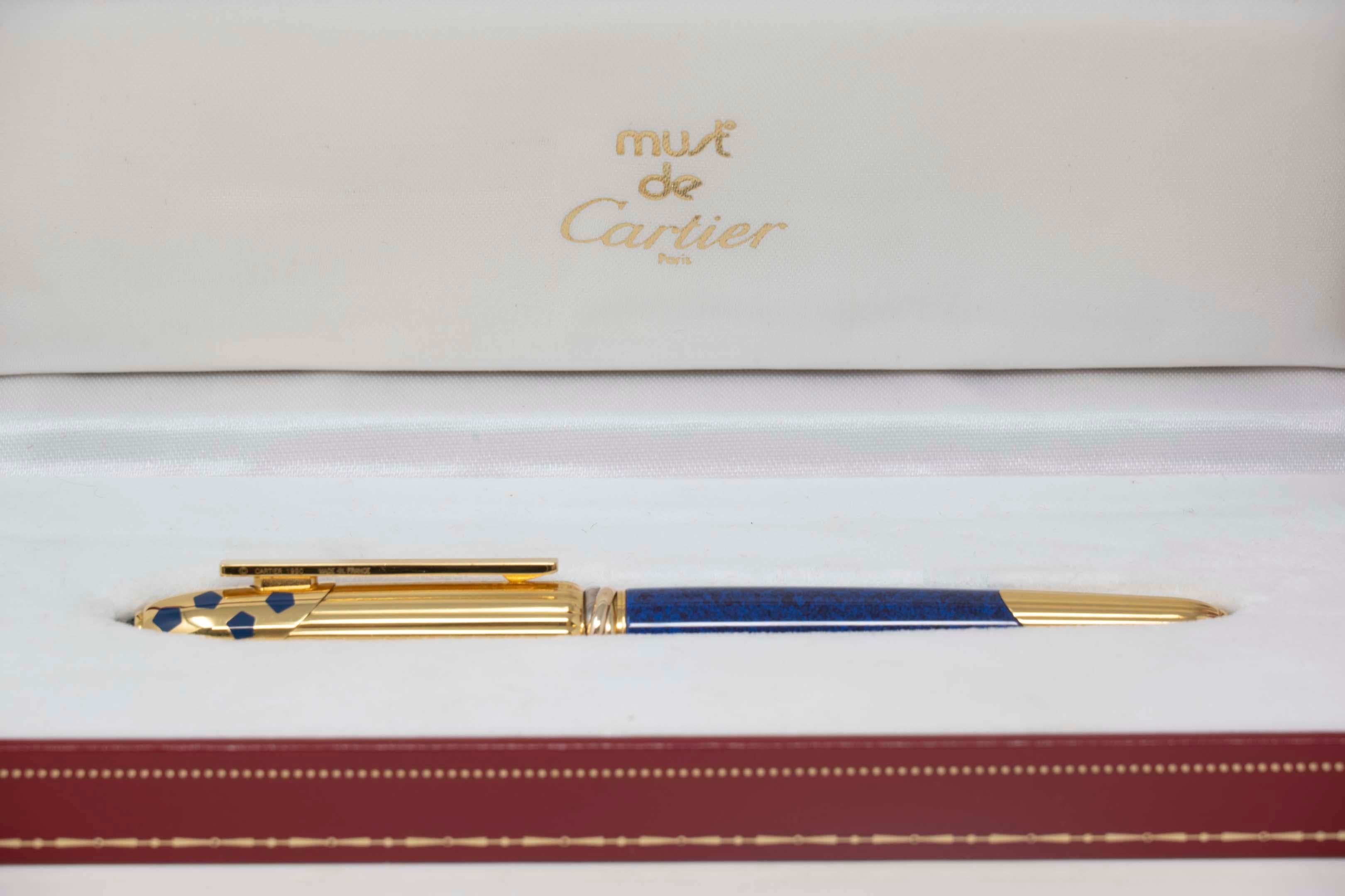 Cartier Panthere  ballpoint pen, 18k gold-plated and blue spotted enamel with original box ref 069009. Measures 13cm long, in good condition, minimal sign of wear. Materials include enamel, gold-plated steel. Circa 1990, original Cartier refill.
