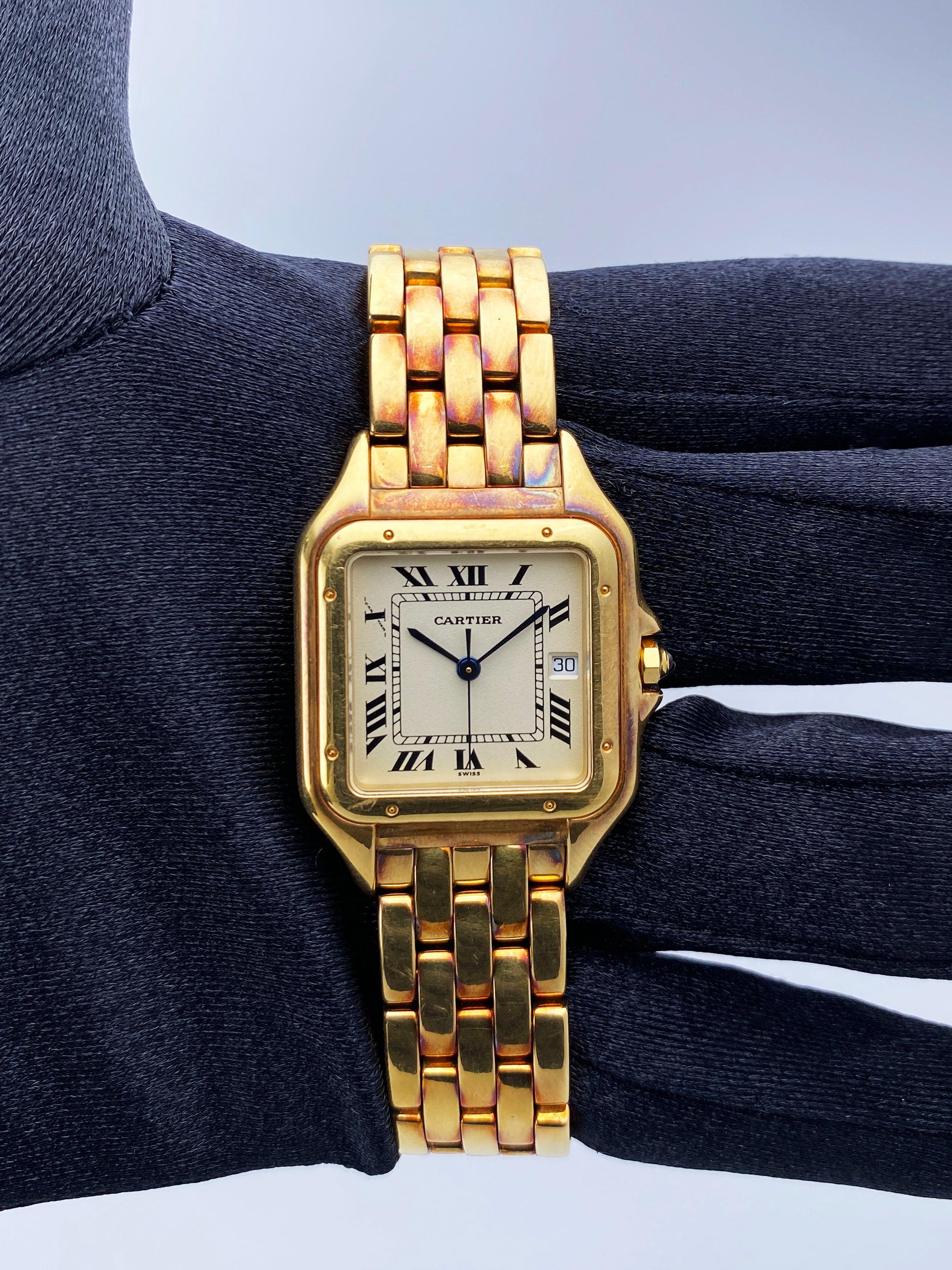 Cartier Panthere Large 106000M Mens Watch. 29mm 18K yellow gold case with 18K yellow gold smoothed bezel. Off-White dial with blue steel hands and black Roman numeral hour markers. Minute markers on the inner dial. Date display at the 3 o'clock