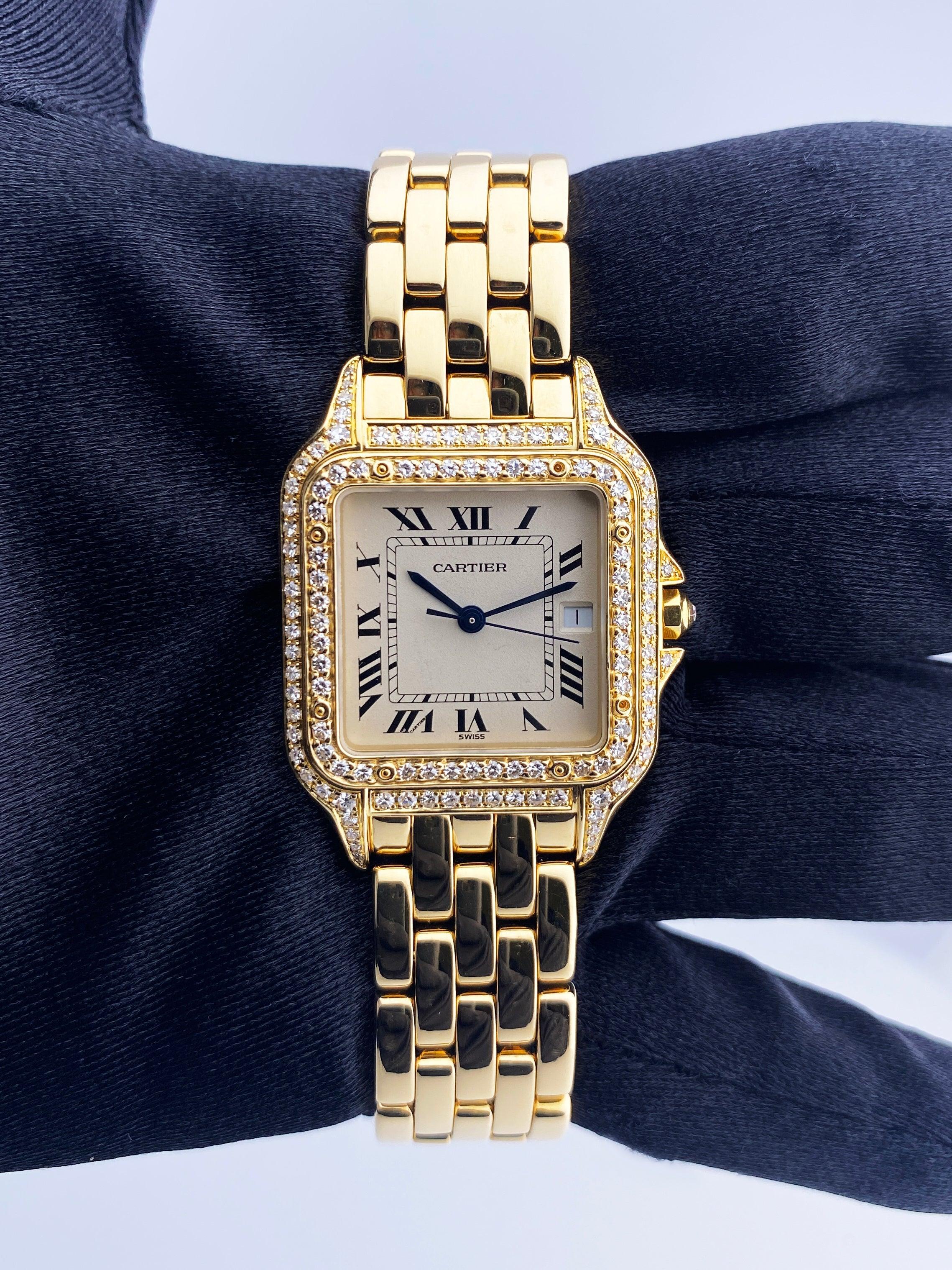Cartier Panthere Large Size Watch. 29mm 18K yellow gold case with original factory diamond set. 18K yellow gold bezel with original factory diamond set. Off-White dial with blue steel hands and black Roman numeral hour markers. Minute markers on the