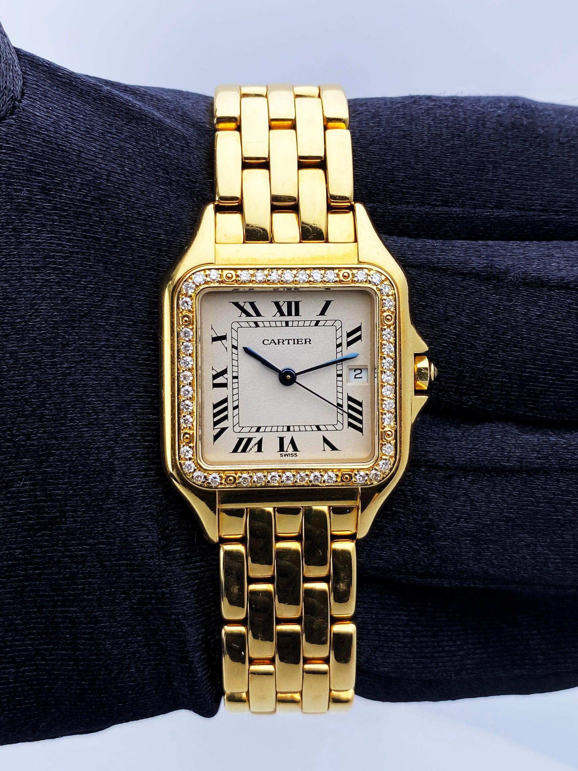 Cartier Panthere Large Size Watch. 29mm 18K yellow gold case. 18K yellow gold bezel with original factory diamond set. Off-White dial with blue steel hands and black Roman numeral hour markers. Minute markers on the inner dial. Date display at the 3