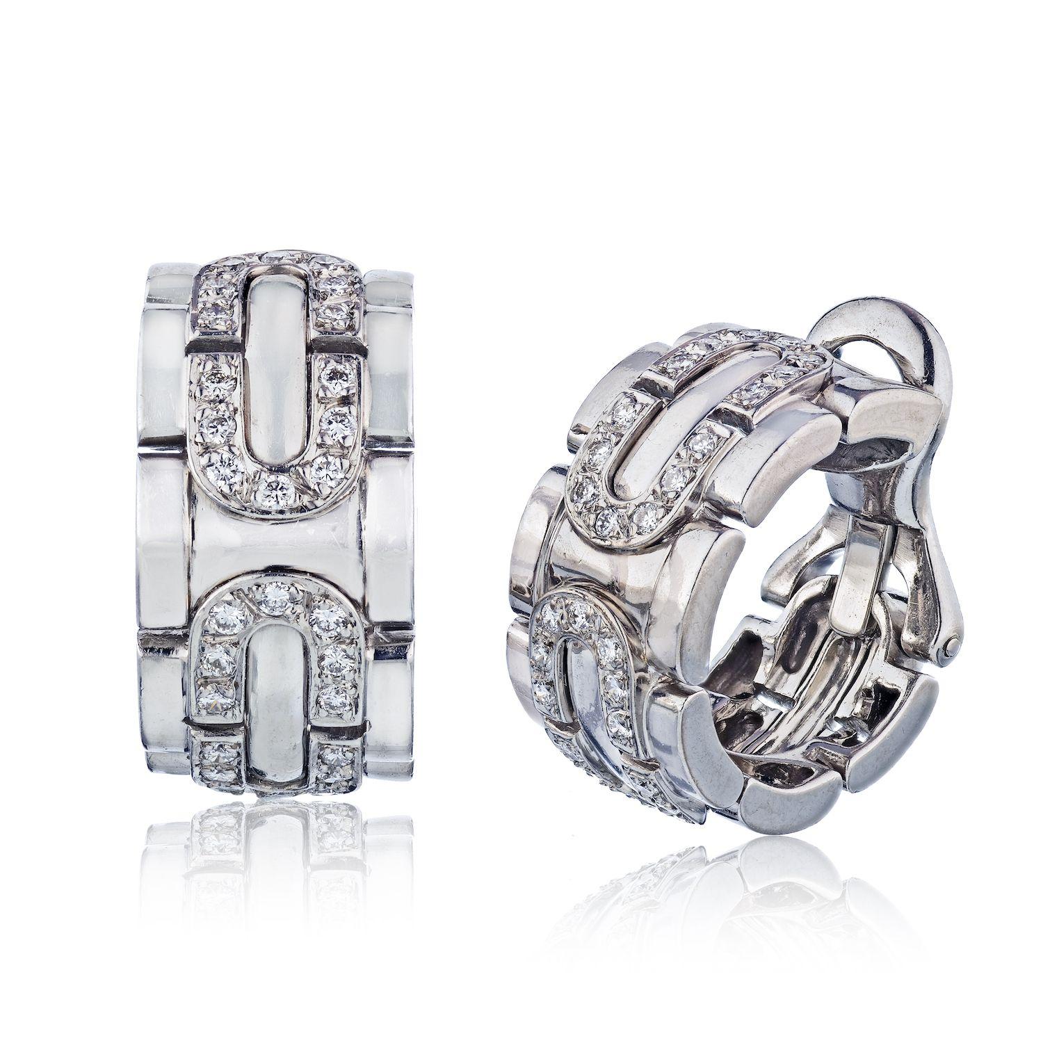 White gold diamond ring and earrings by Cartier 1996. Earrings are for pierced earrings. 
Ring measures: Size 51 EU, US 5.75, width 0.45inches
Earrings measure: 1 inch long, and 0.4 inches wide
