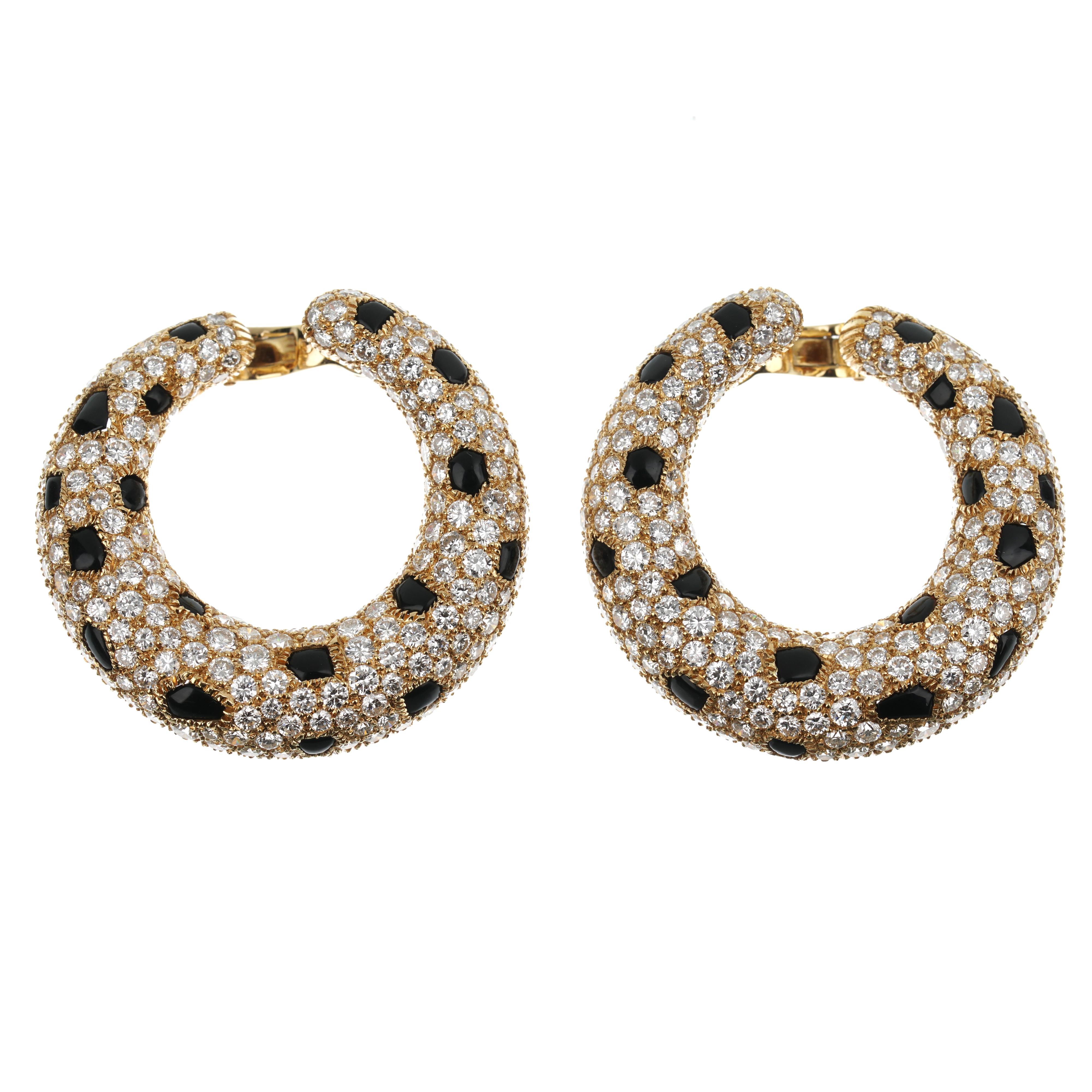 These exquisite Cartier Panthère Onyx Diamond Yellow Gold Vintage Hoop Earrings are a testament to the iconic elegance and craftsmanship synonymous with the Cartier brand. Crafted from the finest 18k yellow gold, these earrings are designed to