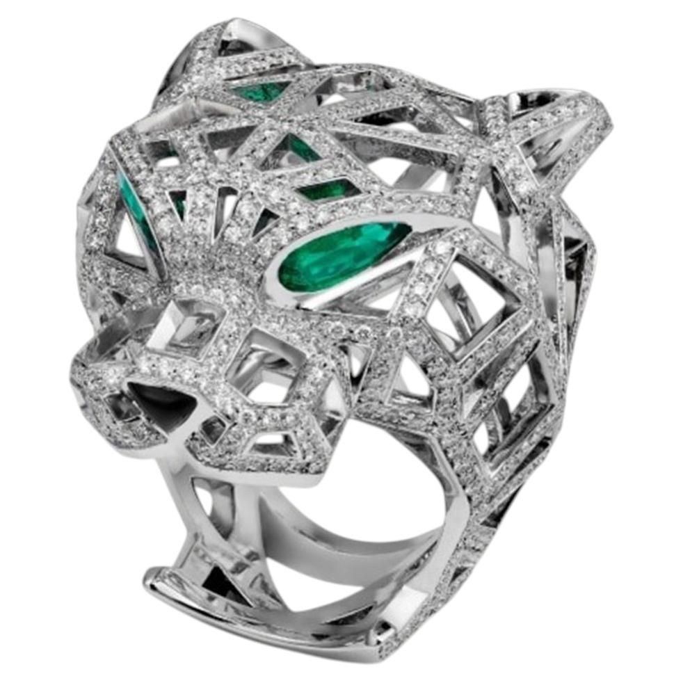 Anillo calado Cartier Panthère con diamantes y esmeraldas, con estuche y documentos